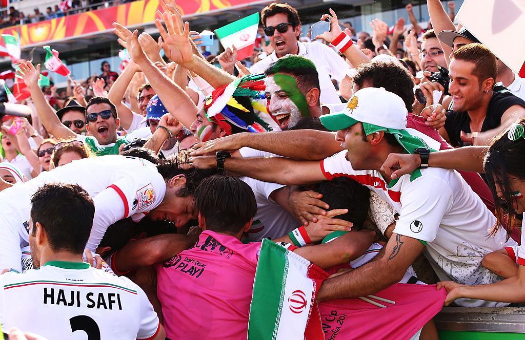 Sardar Azmoun of Iran celebrates with team mates and fans after scoring a goal during the 2015 Asian Cup match between Iran and Iraq at Canberra Stadium on January 23, 2015 in Canberra, Australia