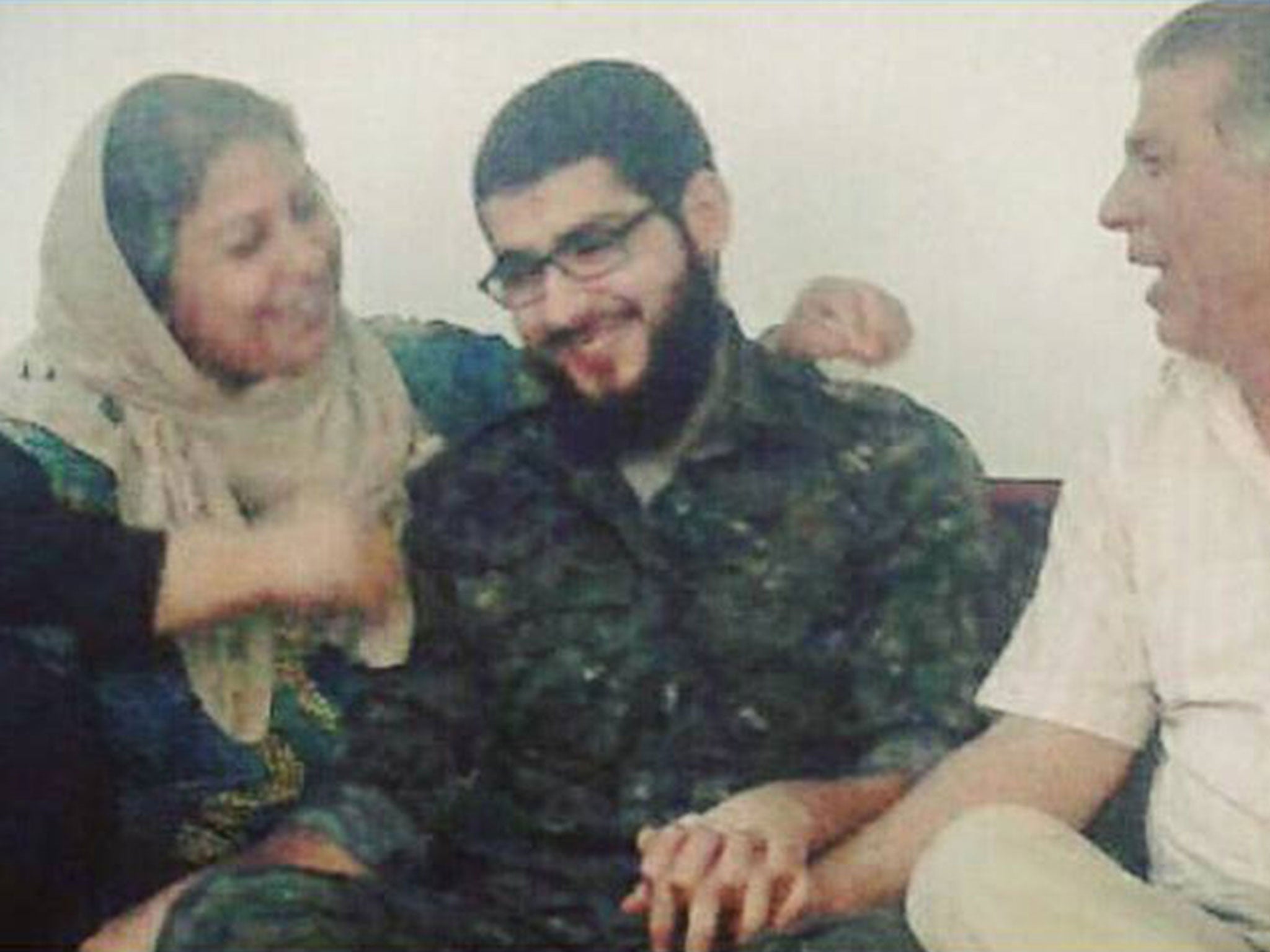 Masoud Aqil being reunited with his parents after nine months in Isis captivity