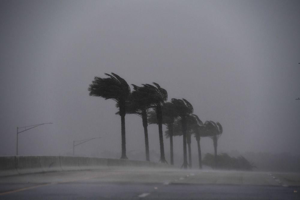 Heavy rain and wind blow in an area near Atlantic Beach, Florida, on October 7, 2016, as hurricane Matthew approaches the area. 
Hurricane Matthew unleashed torrential rains and up to 120 mile-an-hour winds as it hugged the Florida coast Friday, after a blast through the Caribbean that reportedly left at least 400 dead in Haiti. / AFP / Jewel SAMAD        (Photo credit should read JEWEL SAMAD/AFP/Getty Images)