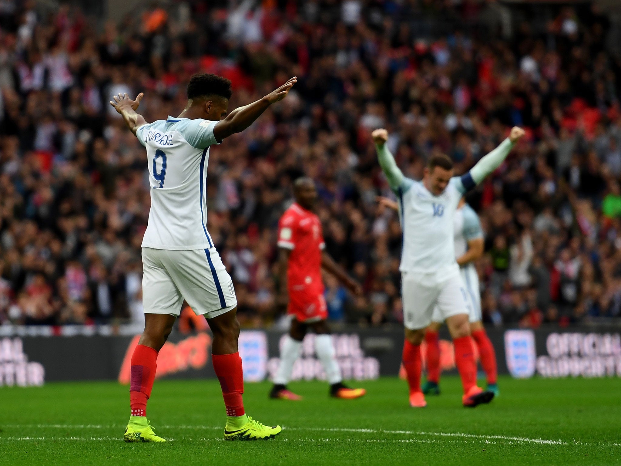 Daniel Sturridge celebrates England's first goal moments before the half hour mark