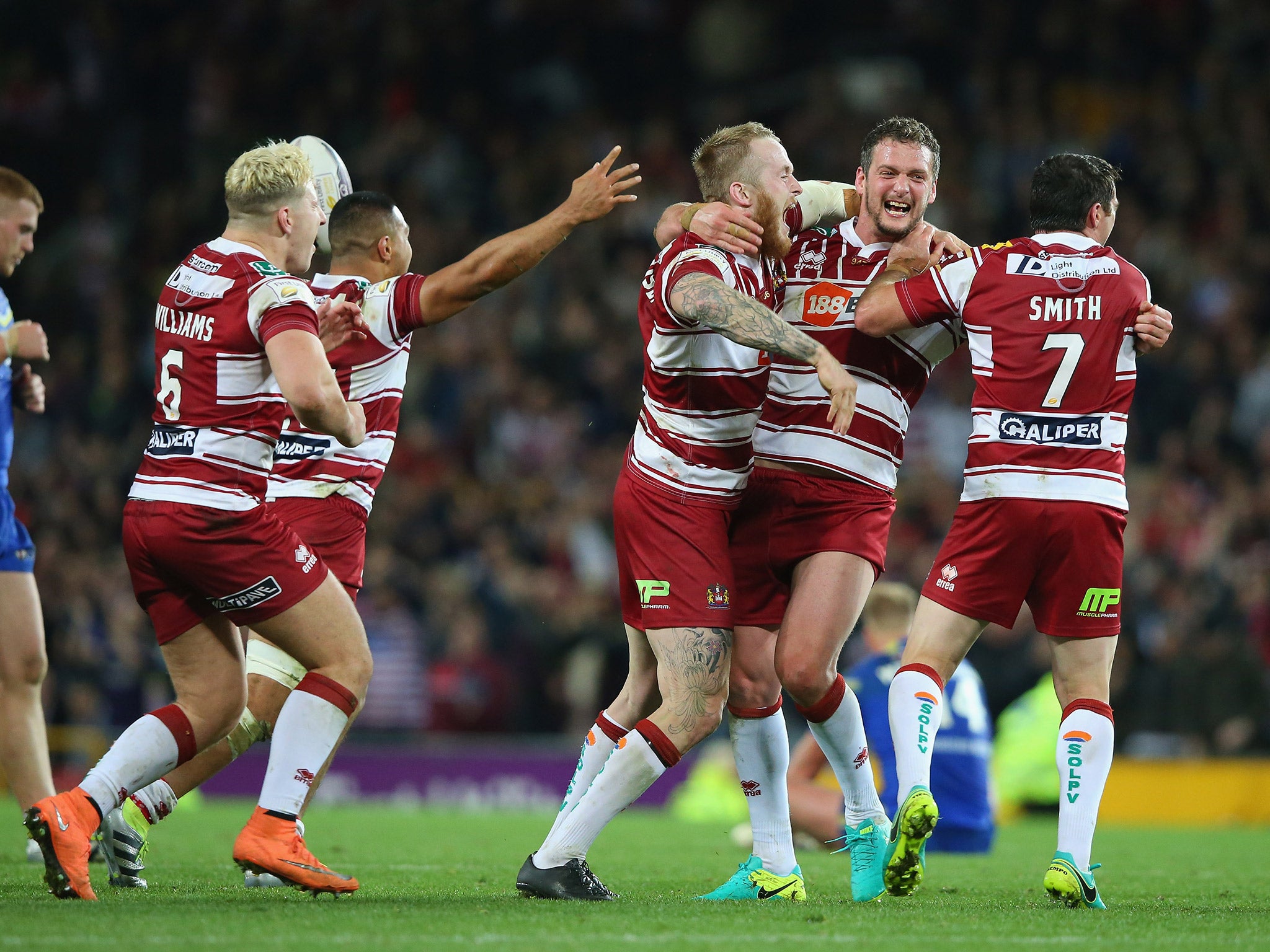 Wigan captain Sean O'Loughlin leads the celebrations at the full-time whistle as Wigan beat Warrington 12-6