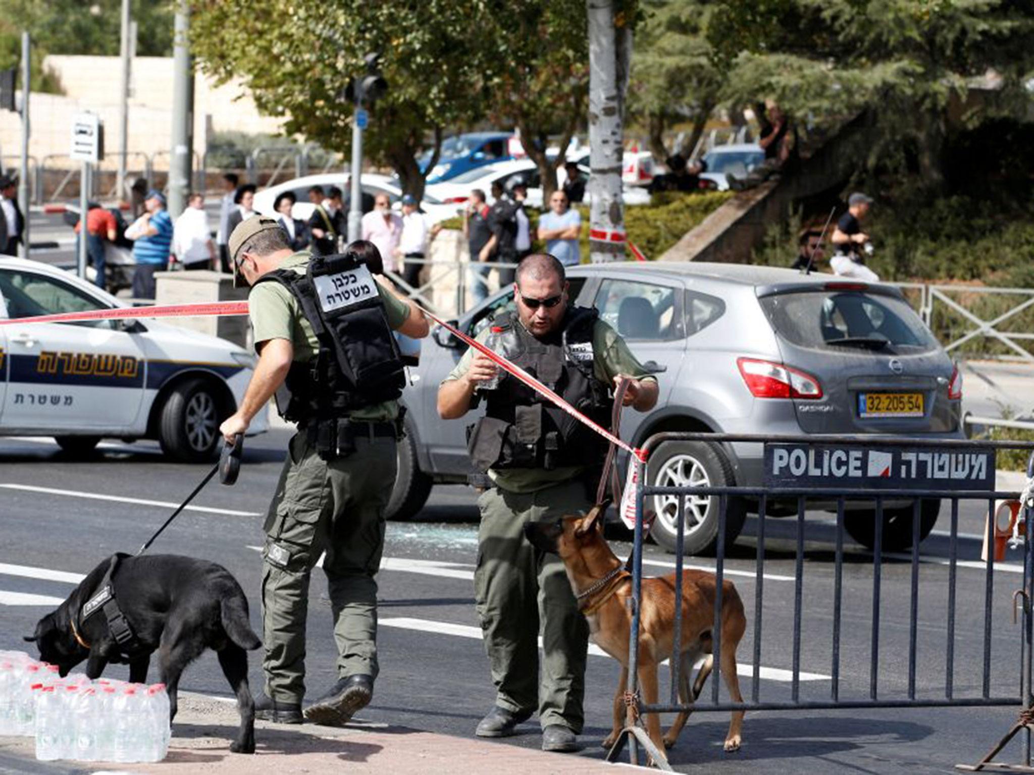 Israeli police secure the area following a shooting incident