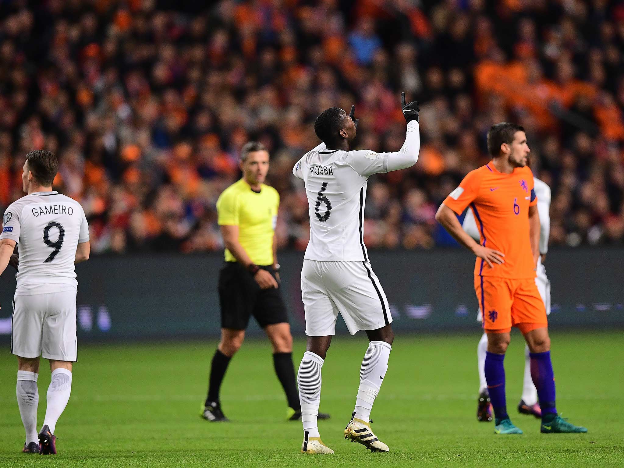 Paul Pogba celebrates scoring the winner for France in Holland