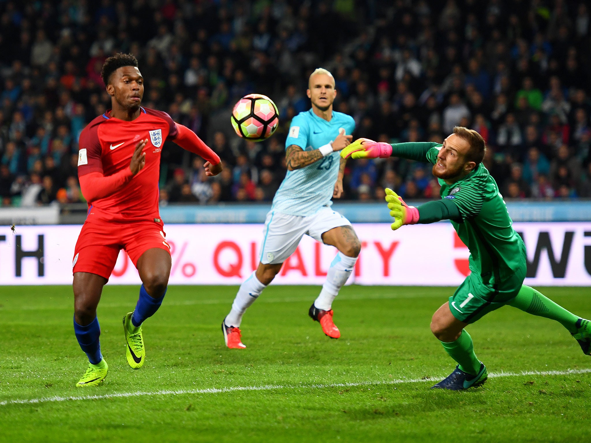 Sturridge battles for the ball with Slovenia's goalkeeper Oblak