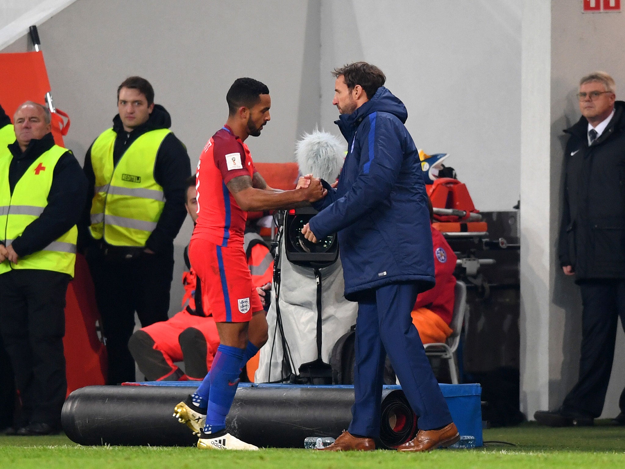 Theo Walcott's time is up against Slovenia as Gareth Southgate shakes his hand after an hour