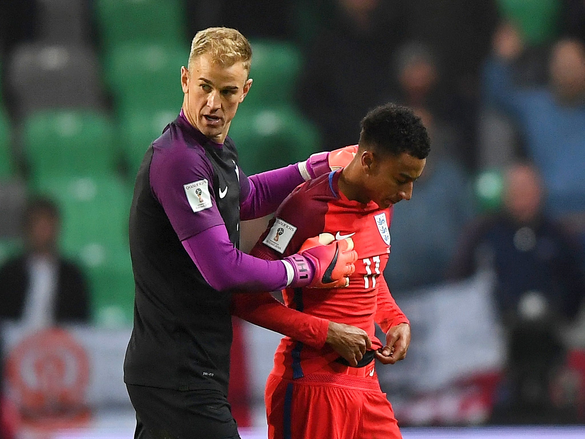 Hart walks off with Jesse Lingard after the game