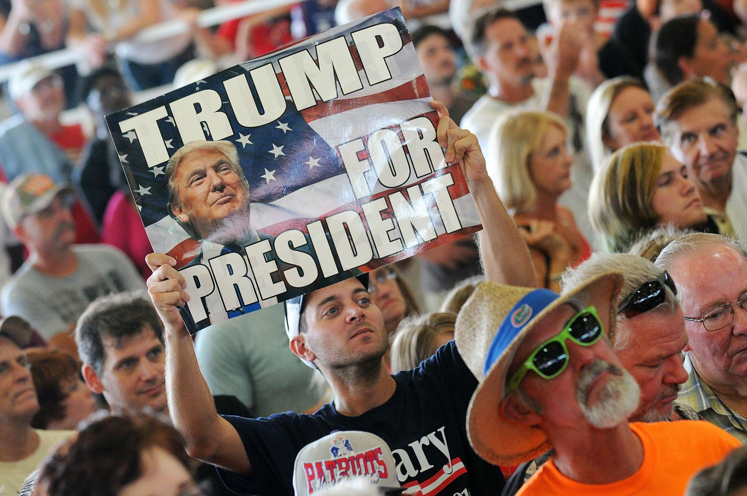 Trump supporters listening to the candidate in a cattle shed in Ocala