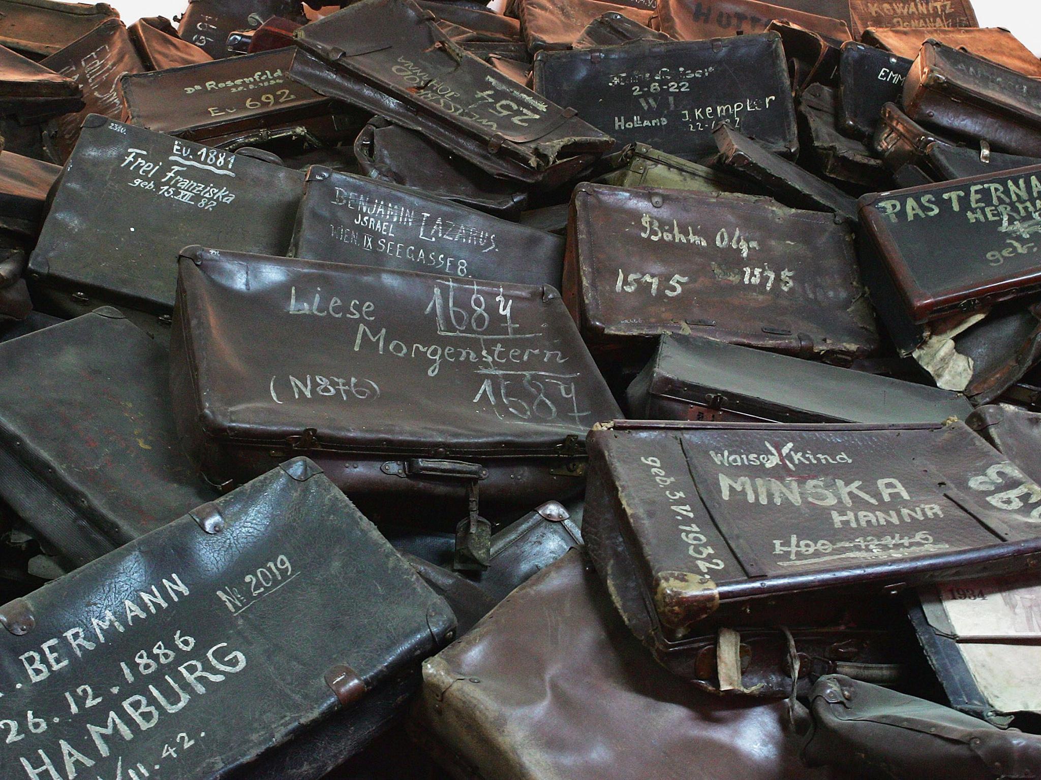 A mass of suitcases removed from men, women and children on their arrival to the concentration camp on display at Auschwitz