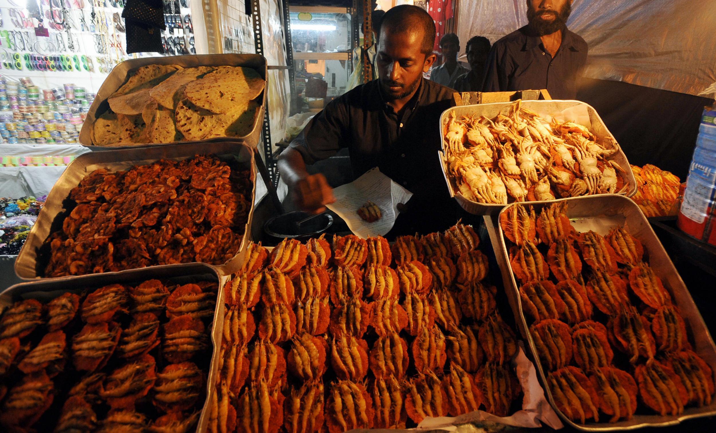 Grab a bite to eat at a street food stall (Getty)