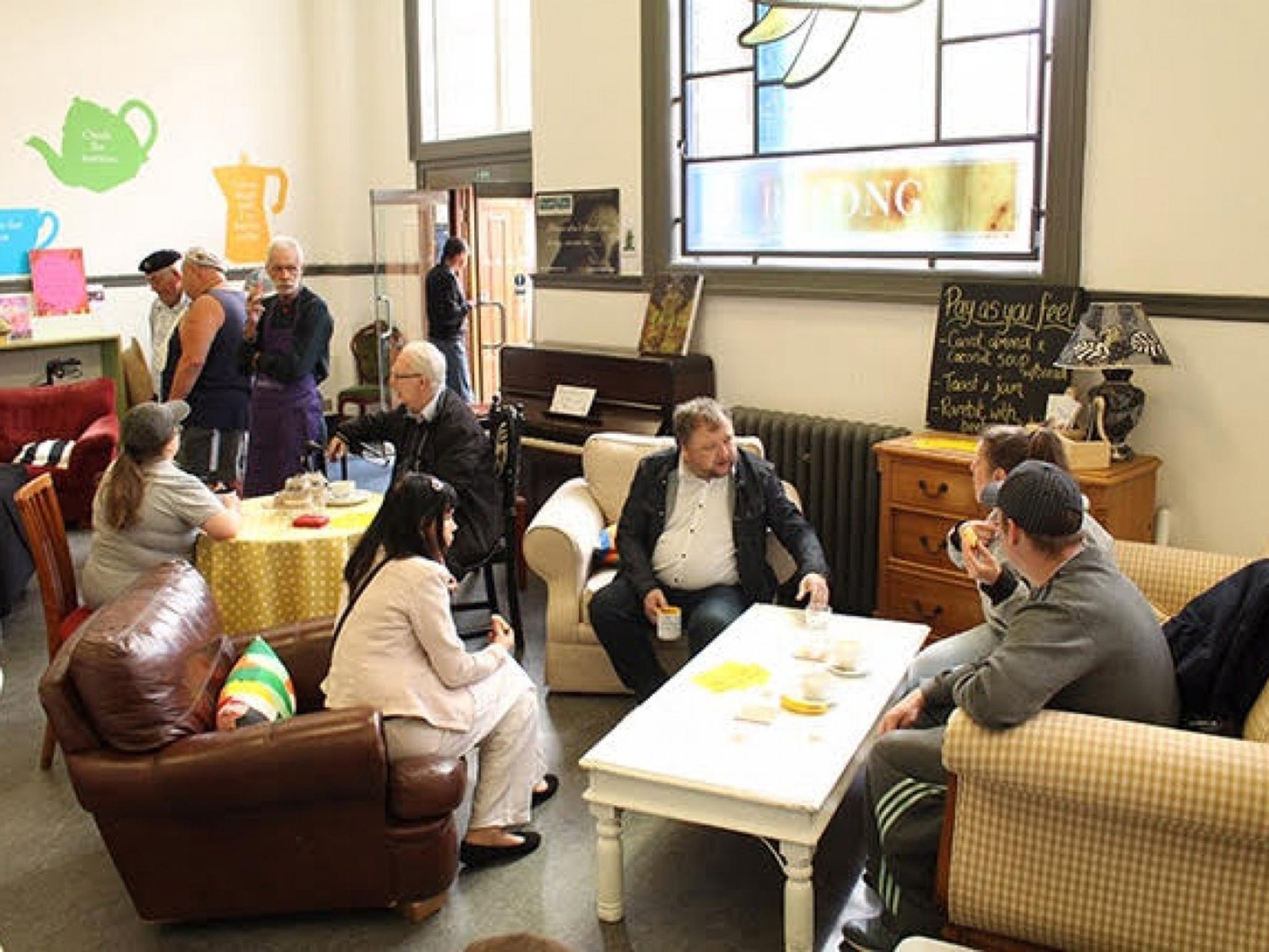 People gather inside Camerados, a space inside a library where people can gather and share their troubles