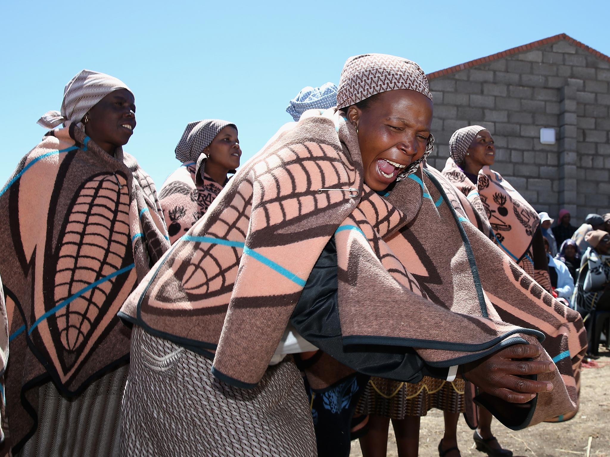 Basotho woman from the Mokhotlong district dance as they celebrate the opening of the new Sentebale Mateanong Herd Boy School