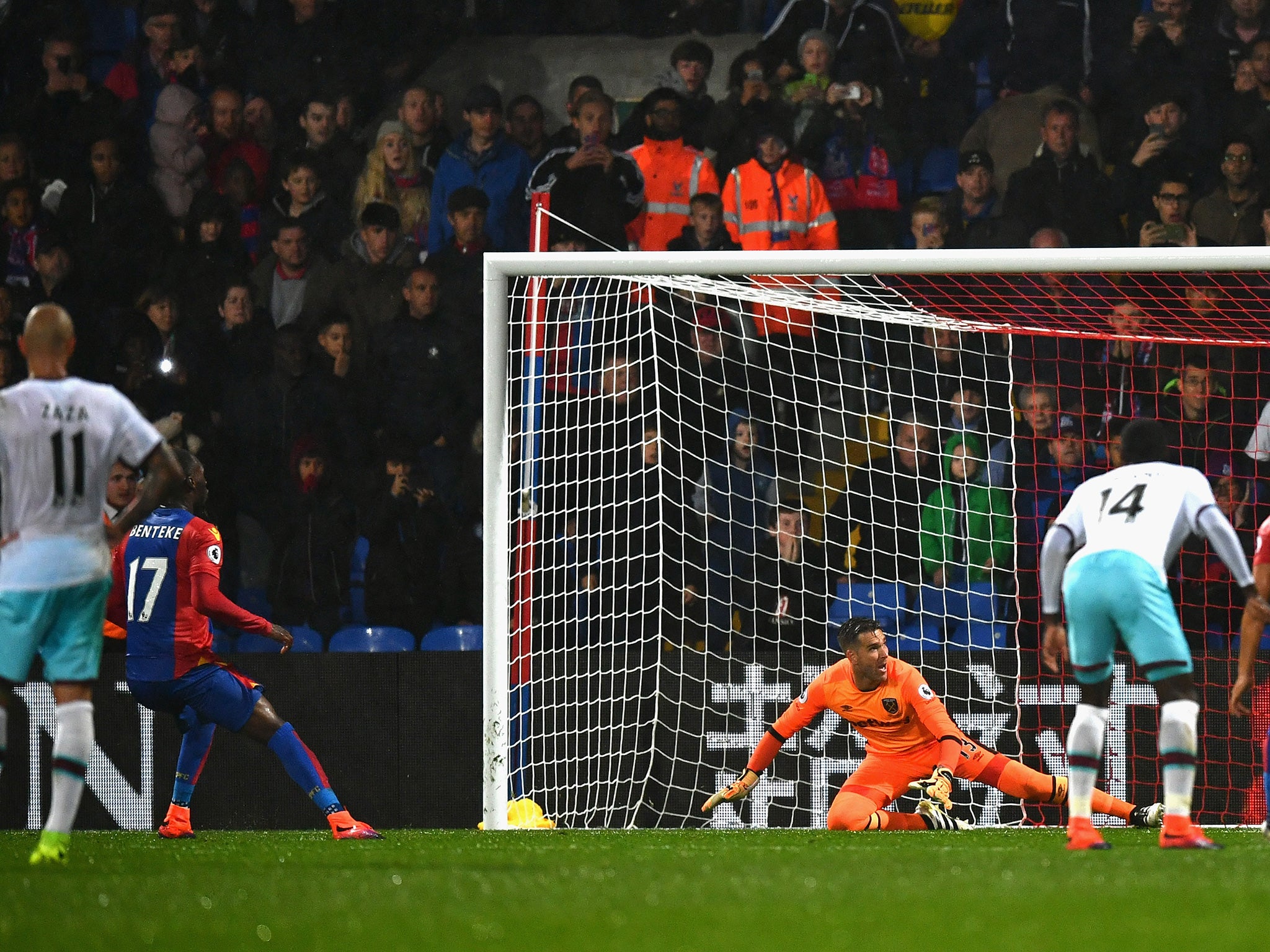 Benteke watches his penalty fly wide of Adrian's post