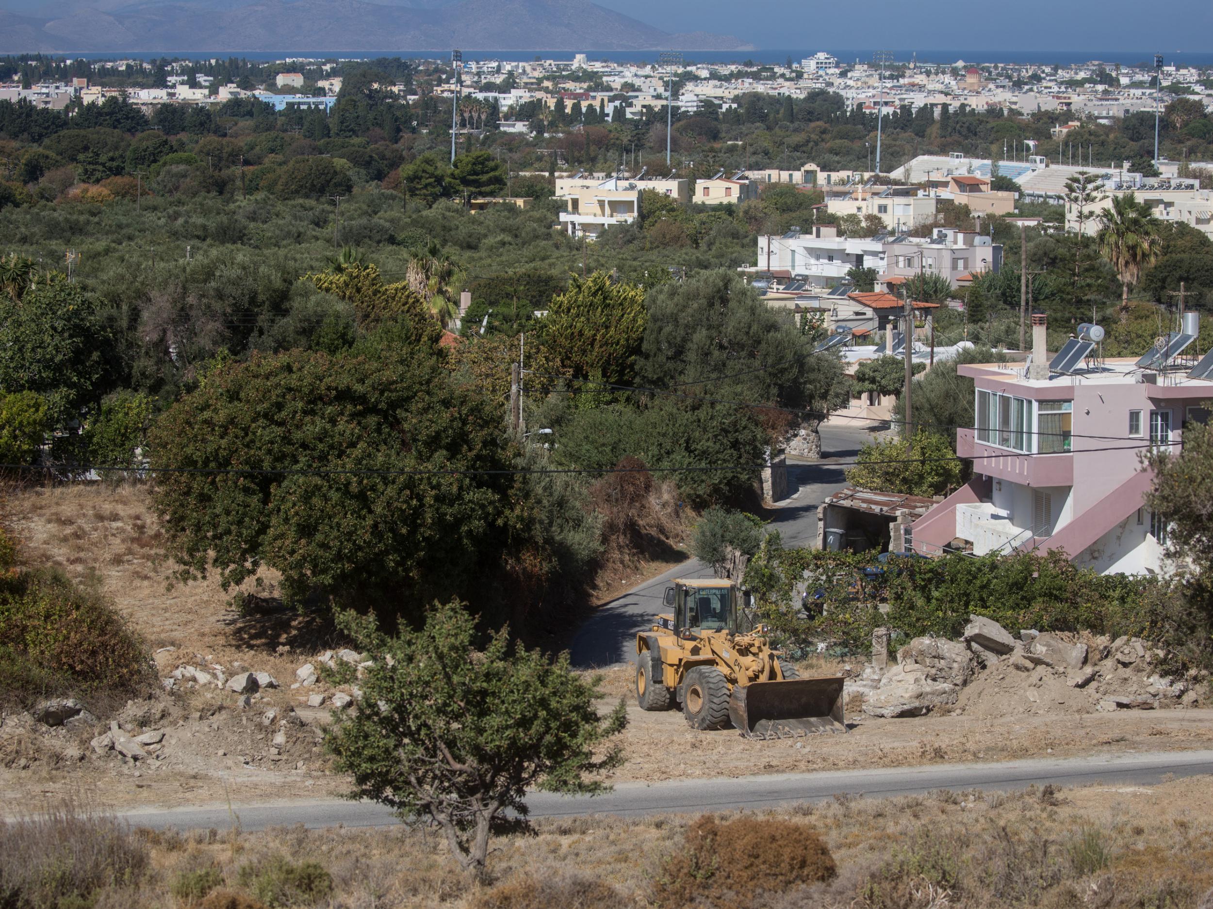 Officers and Greek volunteers had been excavating land around an old farmhouse on Kos, where the toddler was last seen