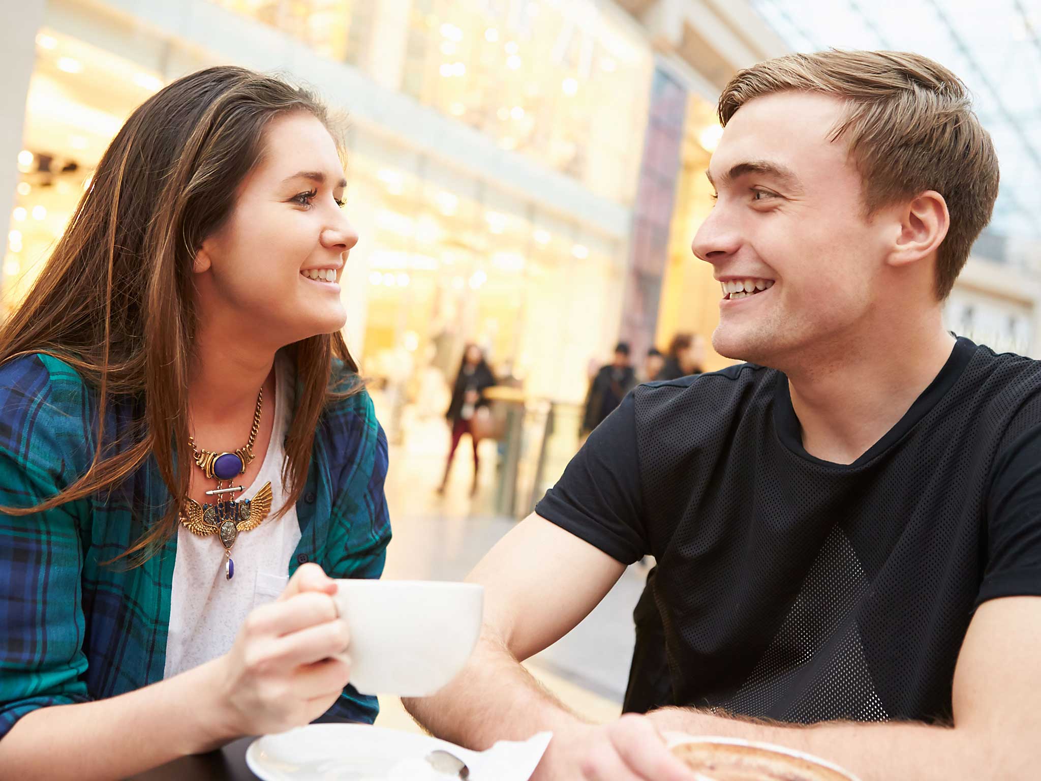 Young Couple Meeting On Date In Café