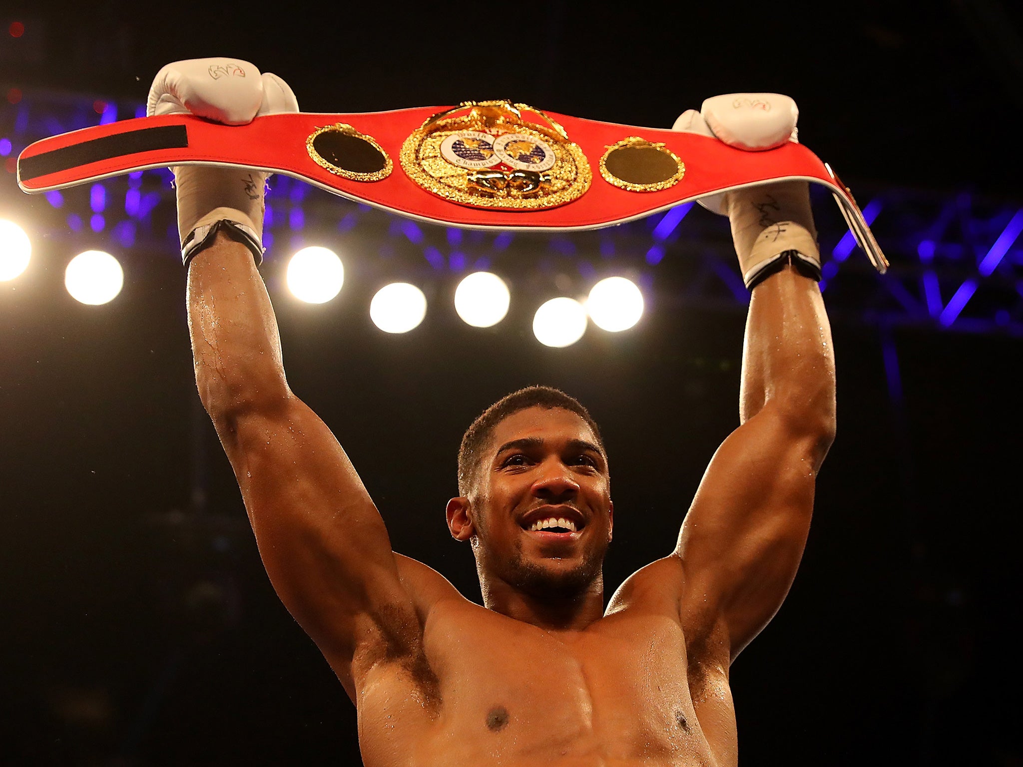 Joshua celebrating with his IBF heavyweight title