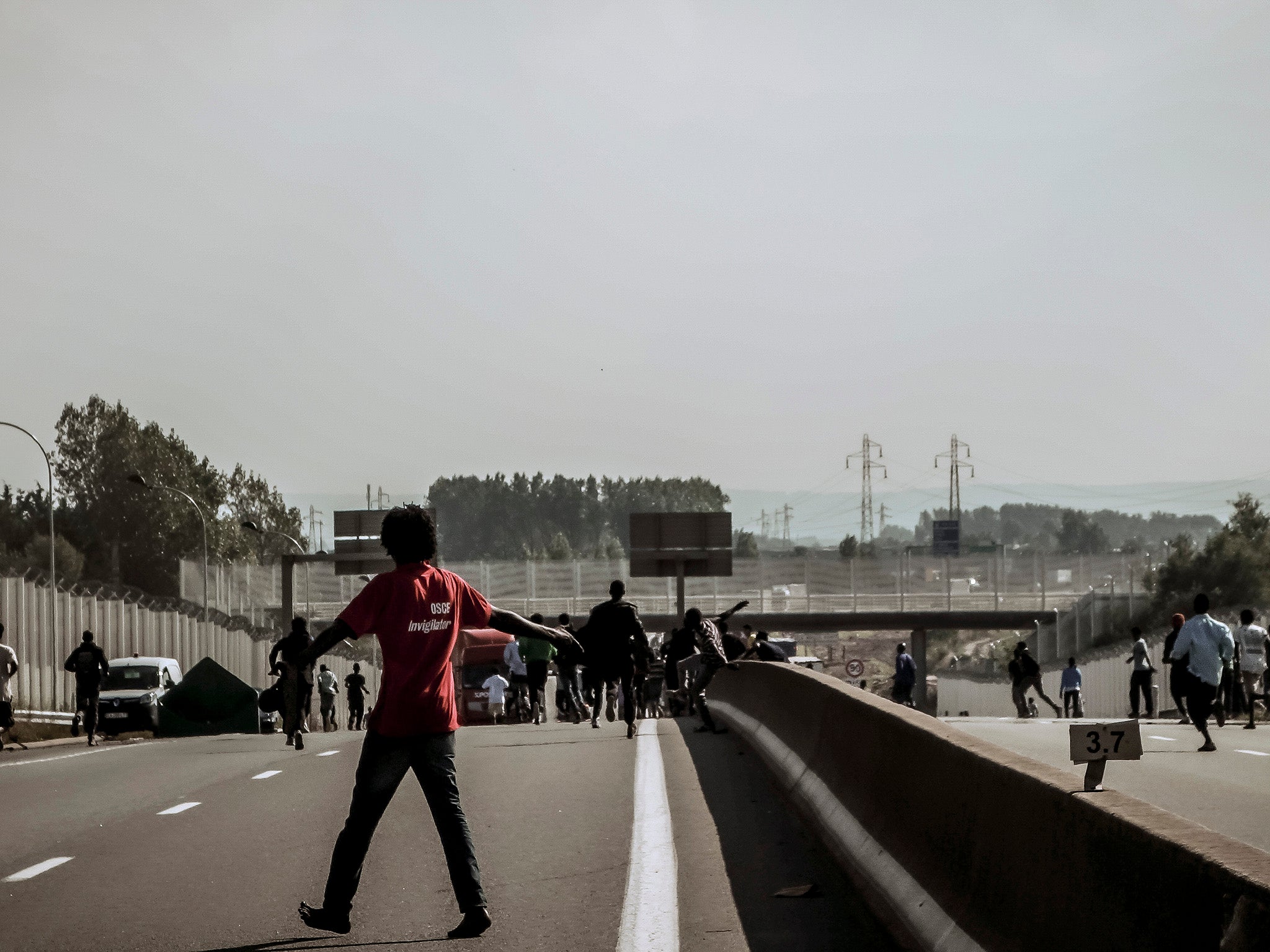 Refugees trying to get onto lorries headed for Britain in Calais