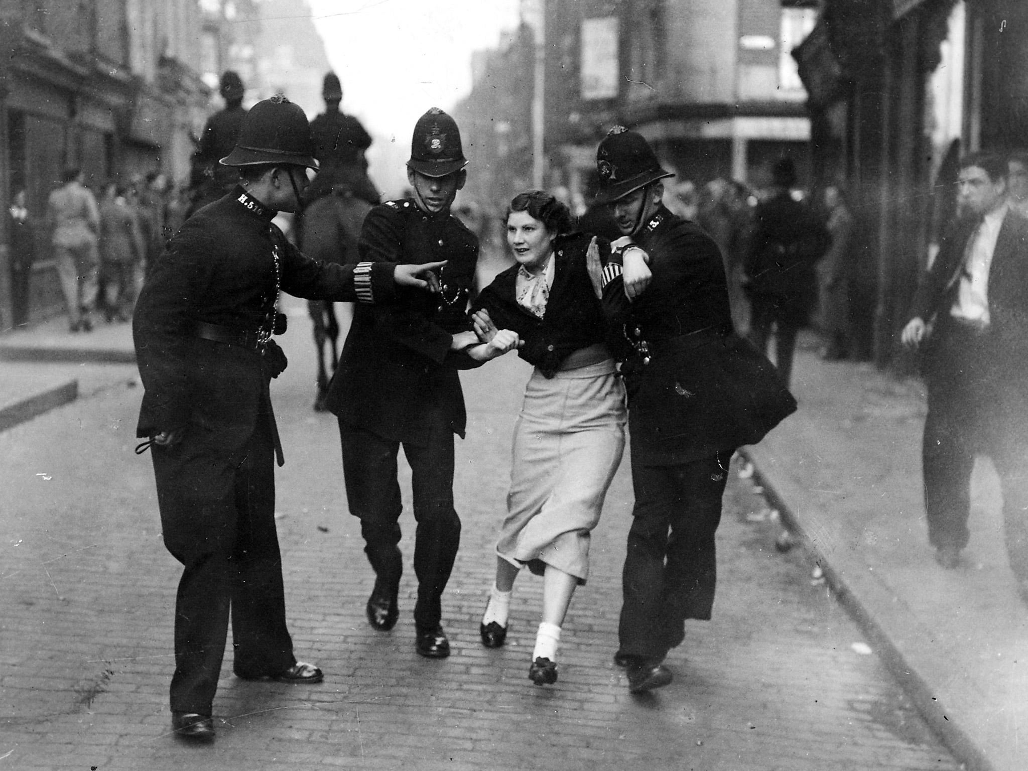 Policemen arresting a demonstrator when fascists and communists clashed during a march know as the Battle of Cable Street, led by British fascist Sir Oswald Mosley, in London’s East End