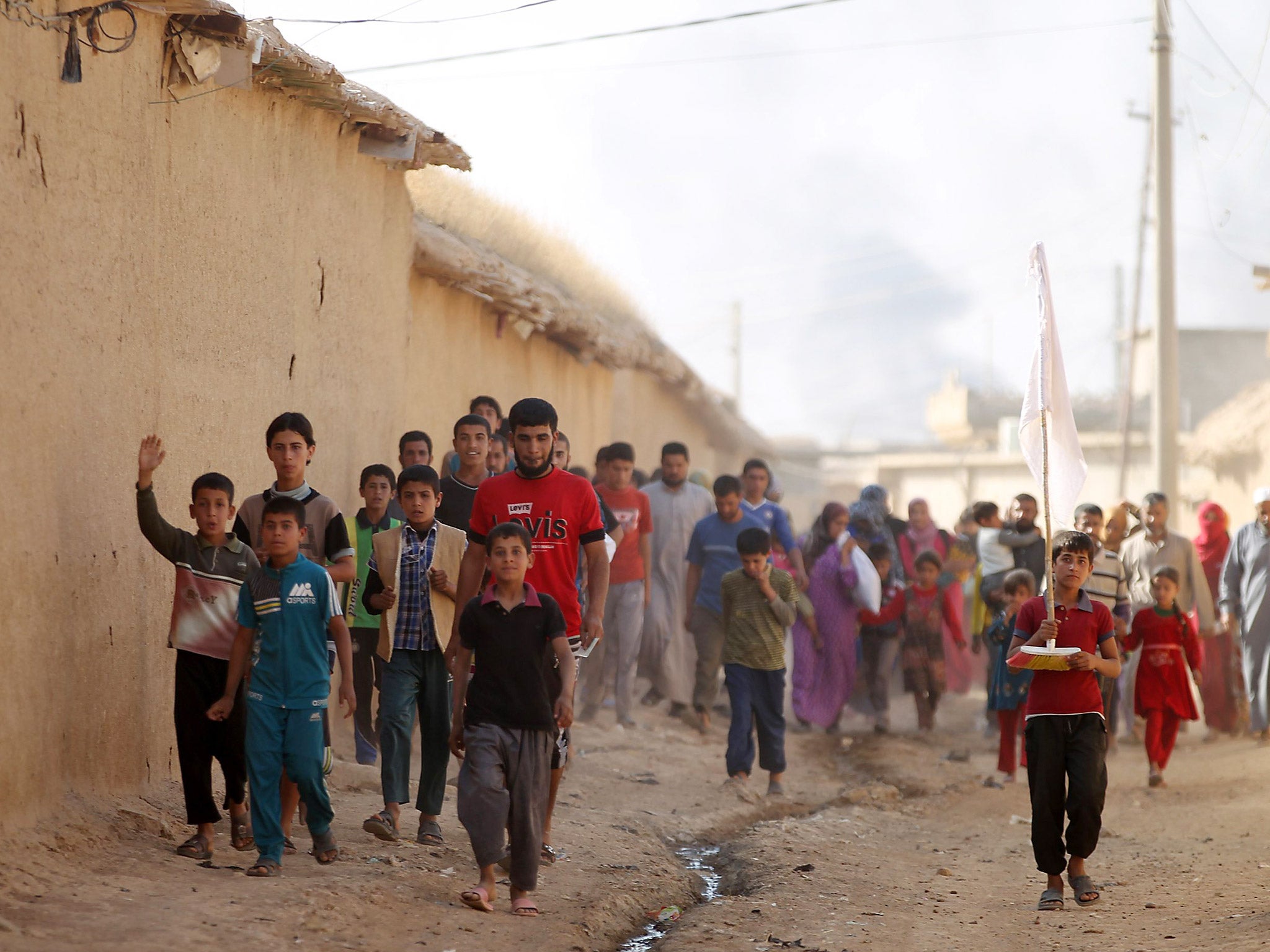 Displaced Iraqis from a village outside Mosul, who fled fighting in the area