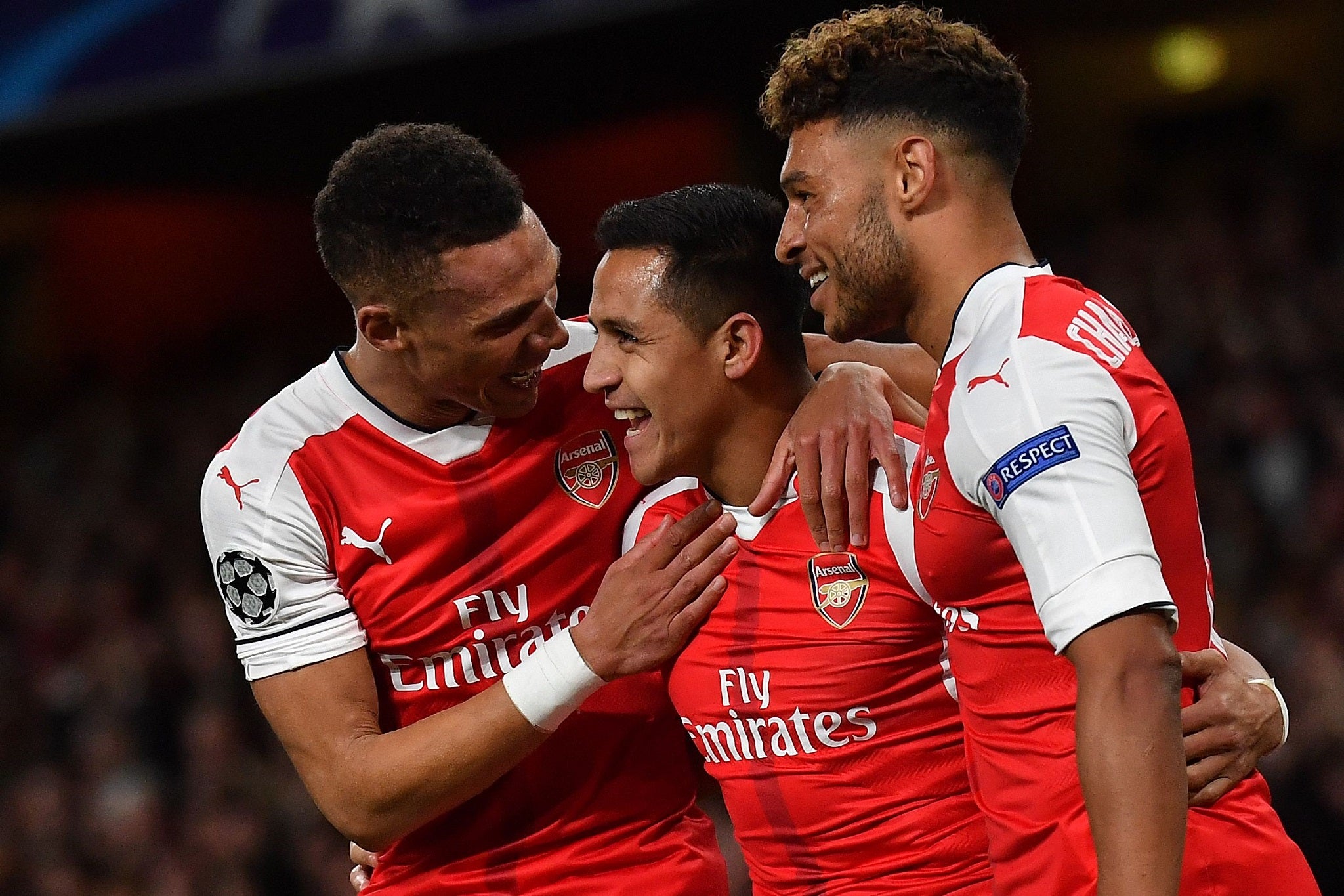 Alexis Sanchez celebrates with Kieran Gibbs and Alex Oxlade-Chamberlain after scoring the opener