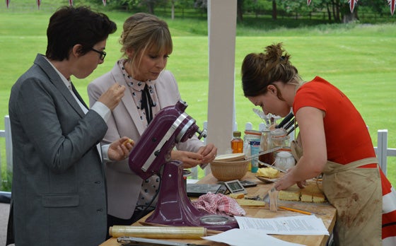 Candice grafting on her fondant fancies in the showstopper