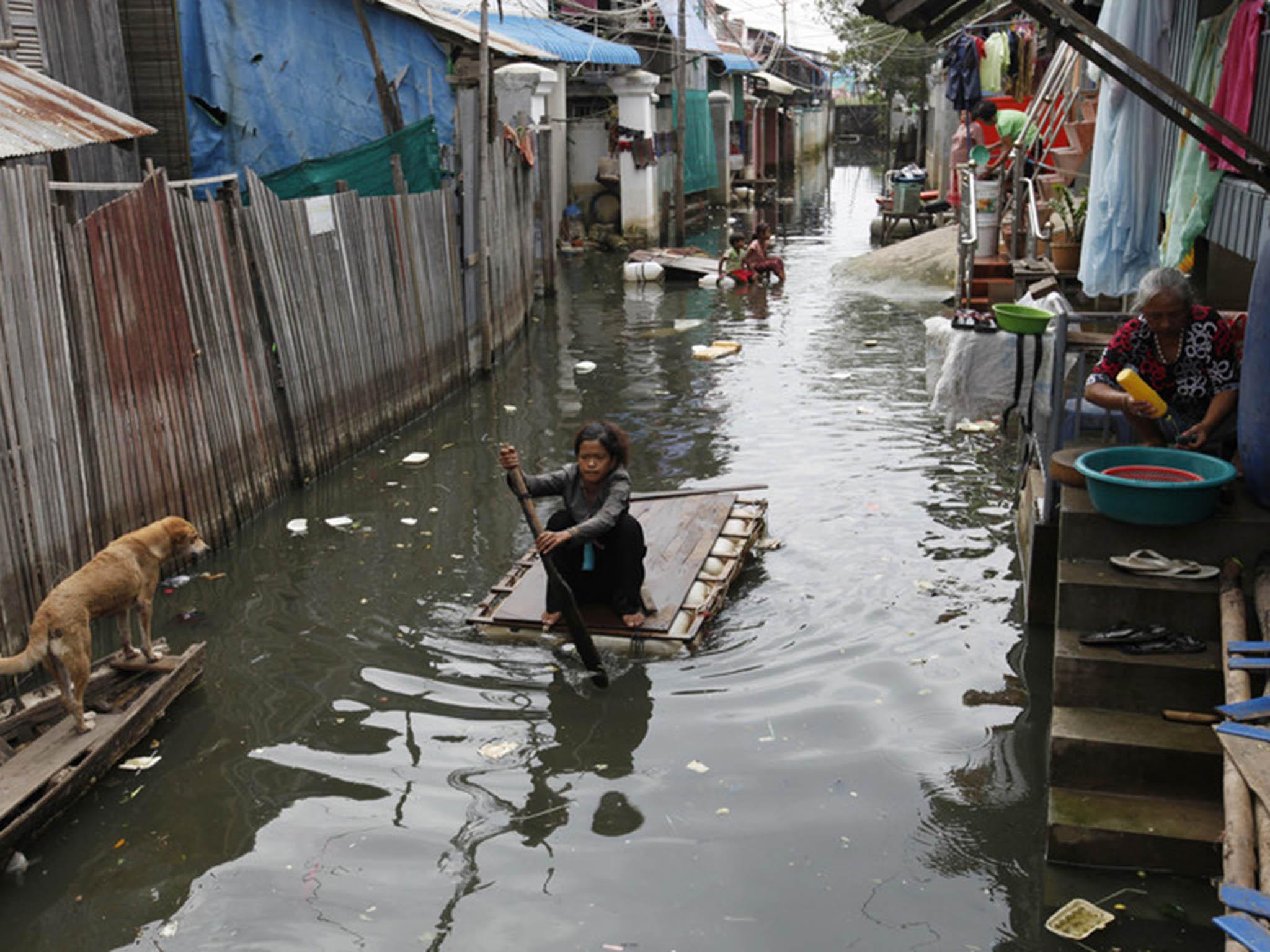 Floods in 2013 killed at least 100 and affected millions more (Mak Remissa/EPA)