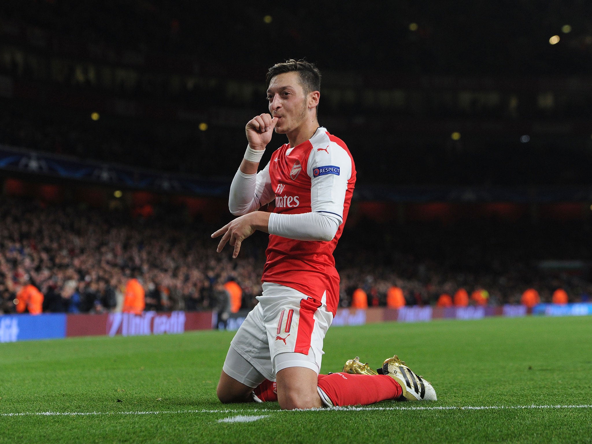 Mesut Ozil celebrates his third goal against Ludogorets