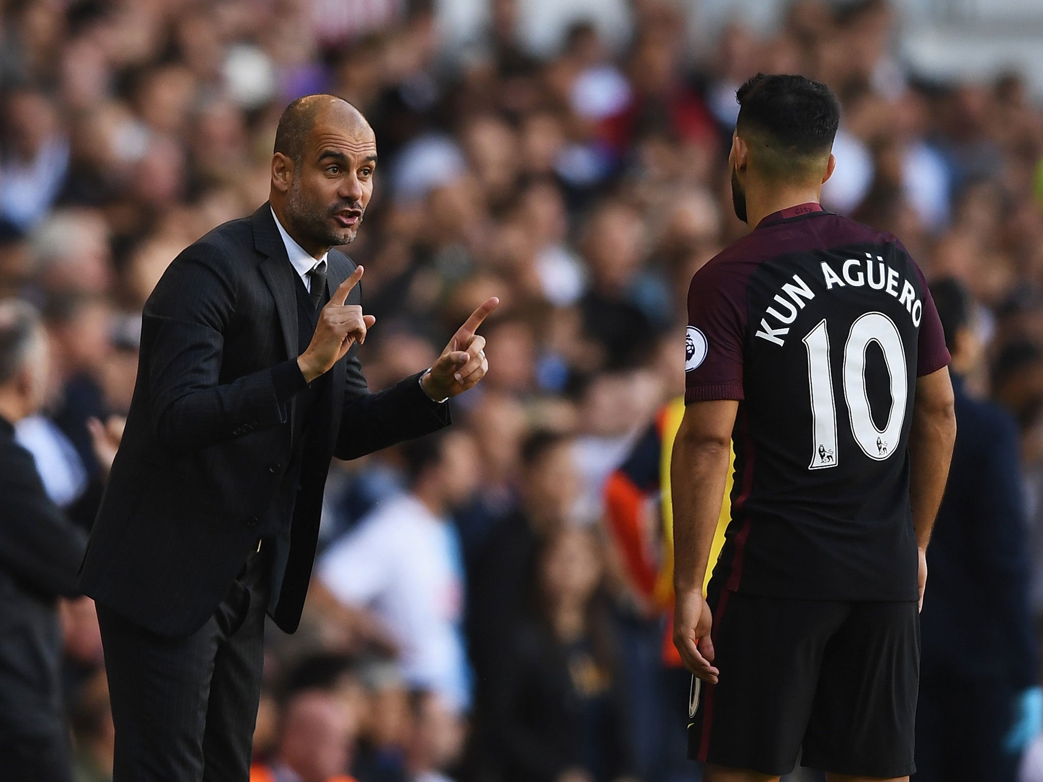 Pep Guardiola issues instructions to Sergio Aguero during City's recent 2-0 defeat by Tottenham