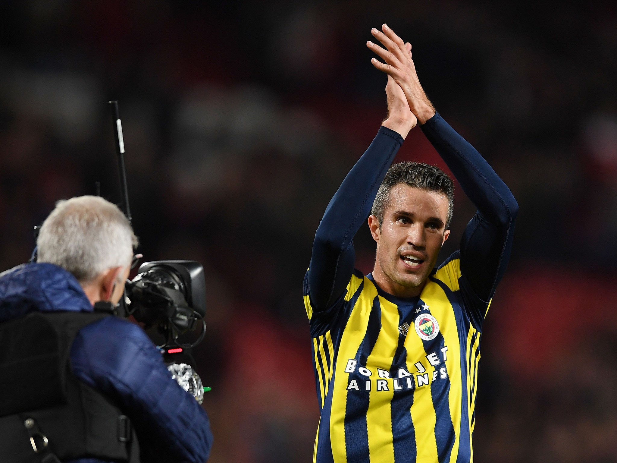 Van Persie applauds the Old Trafford crowd as he departs the pitch