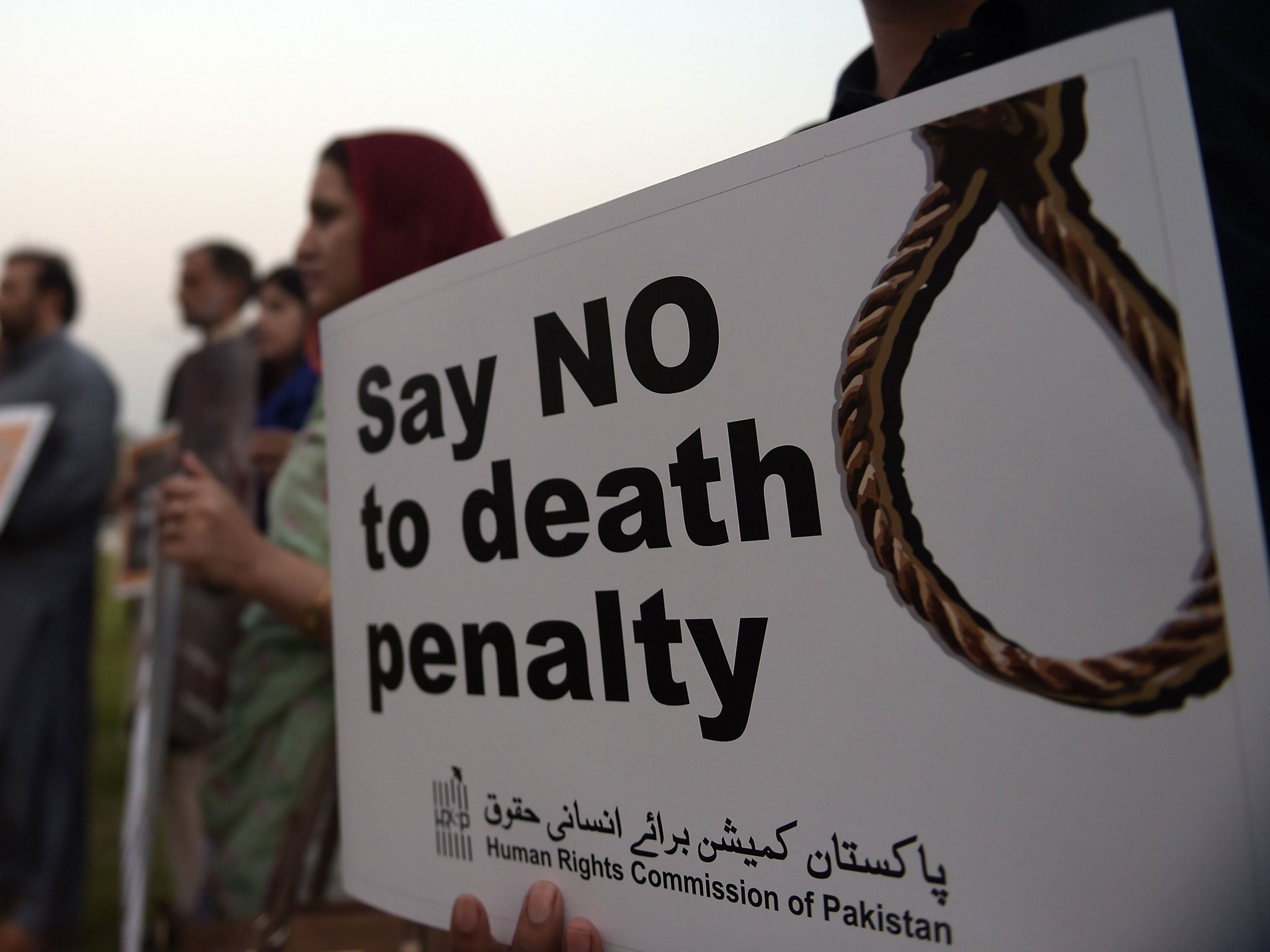 Activists from the Human Rights Commission of Pakistan (HRCP) carry placards during a demonstration to mark International Day Against the Death Penalty in Islamabad on October 10, 2015