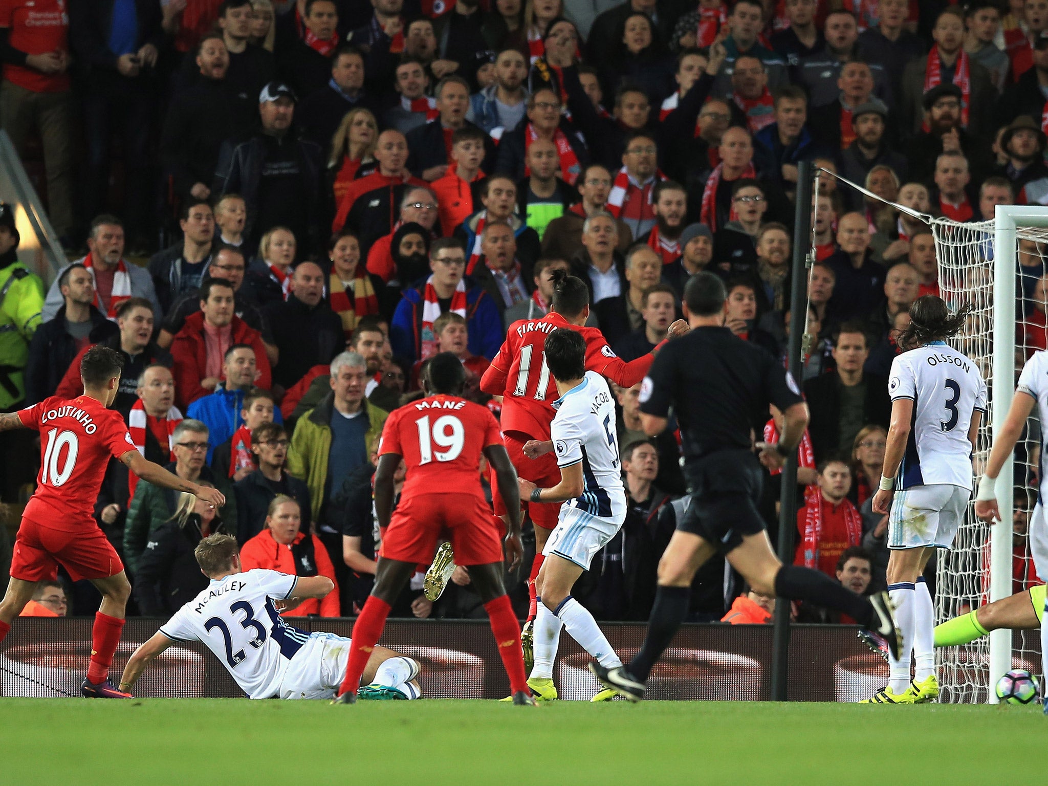 Philippe Coutinho (far left) scores Liverpool's second against West Brom