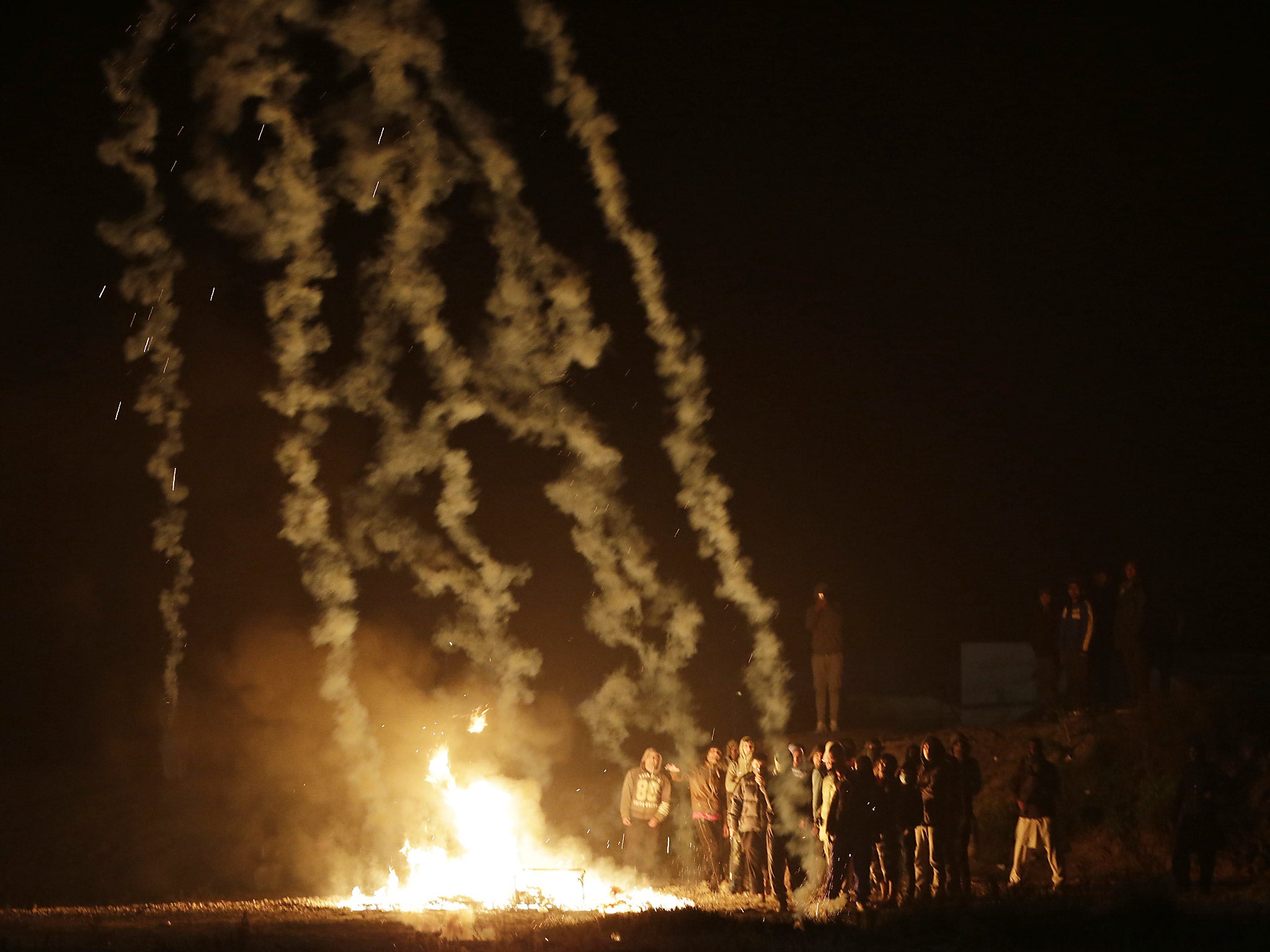 Fires were lit as the French authorities prepared to close the slum-like camp in Calais