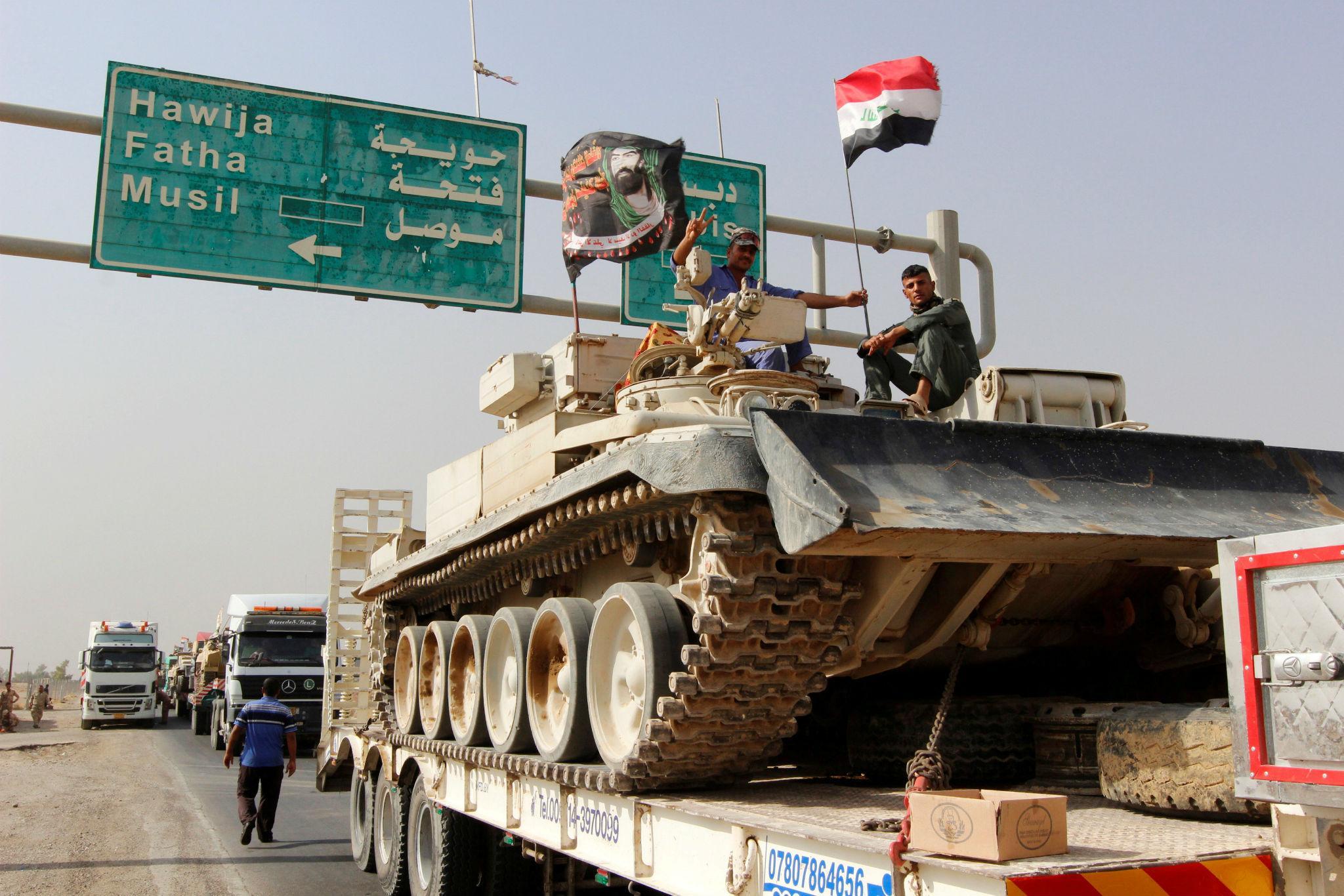 A convoy of Iraqi forces advances on Mosul in the days before the offensive was launched against the Isis-held city