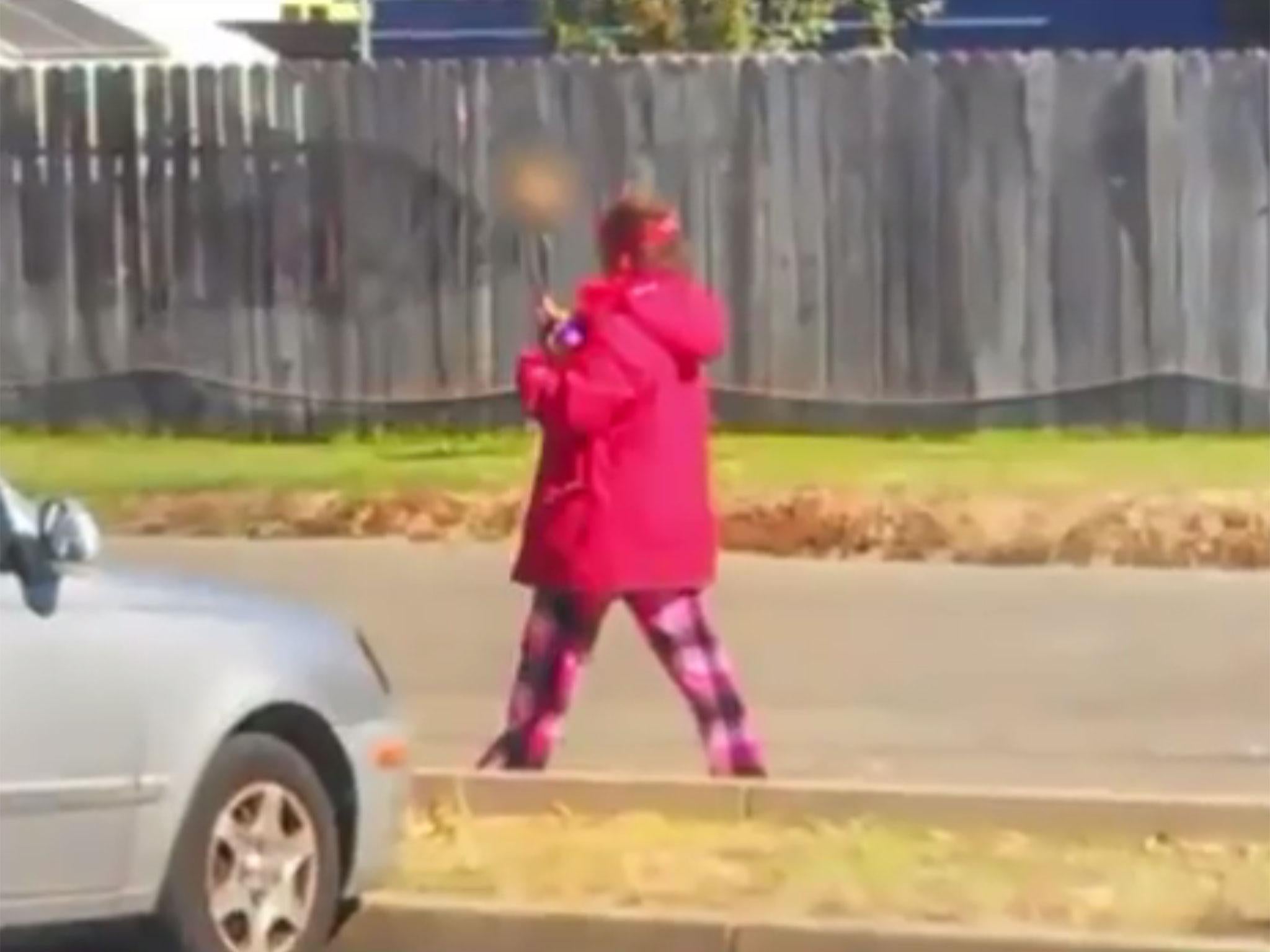 A picture of the woman was captured showing her walking holding the skull in front of her