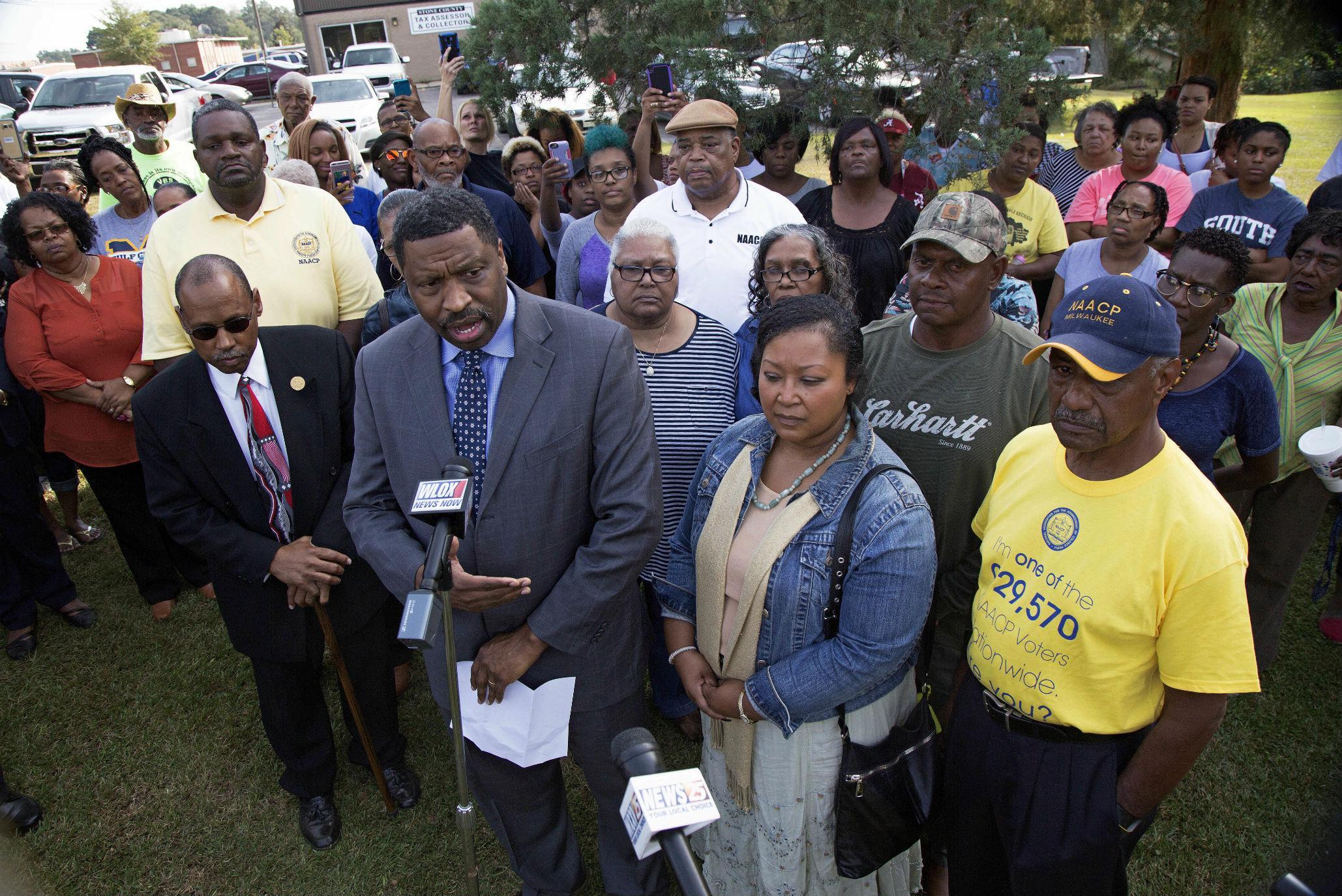 Mississippi NAACP president Derrick Johnson holds a press conference in Wiggins with the alleged victim's parents, Hollis and Stacey Payton