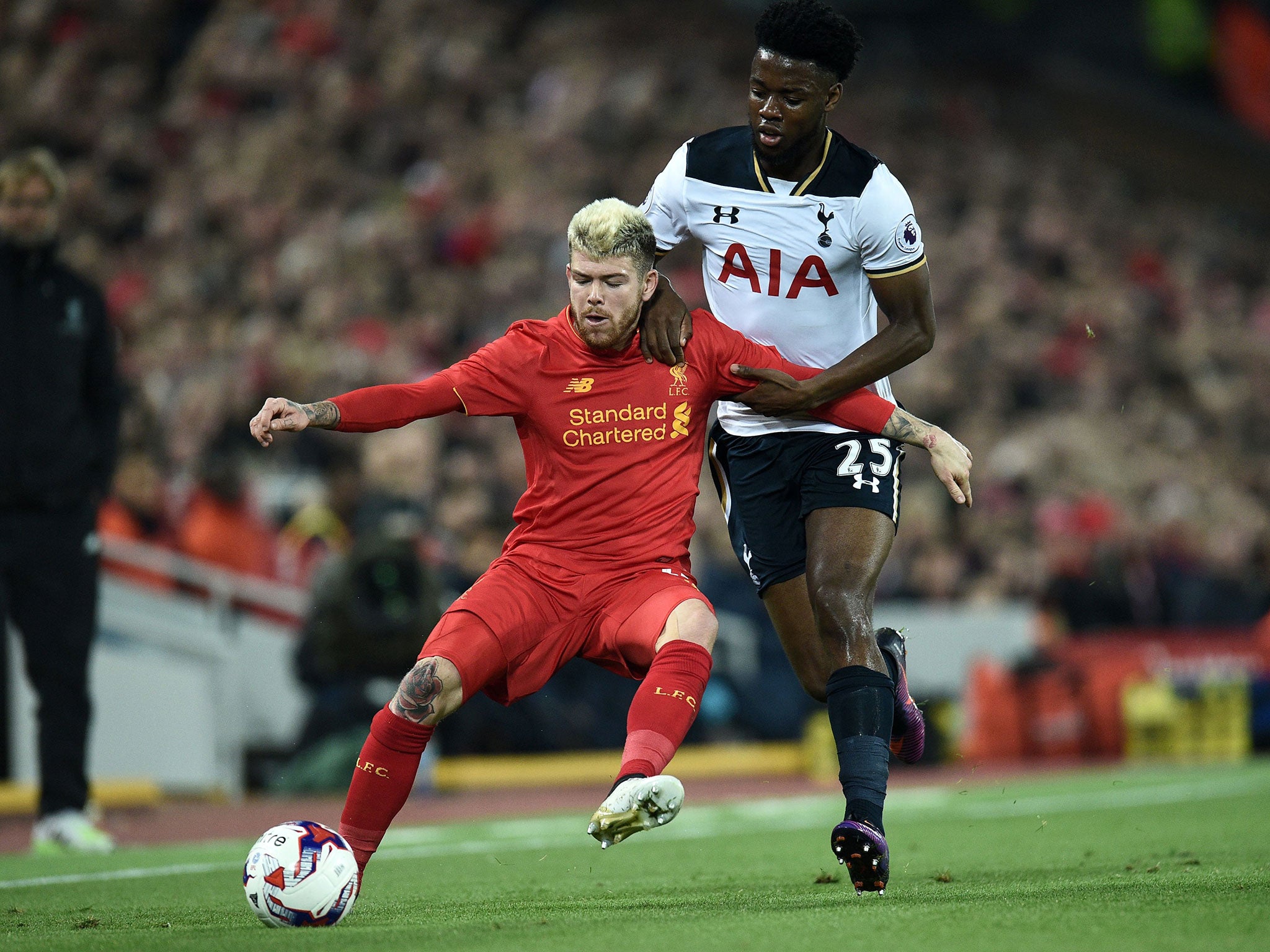 Alberto Moreno tussles for the ball with Tottenham's Joshua Onomah