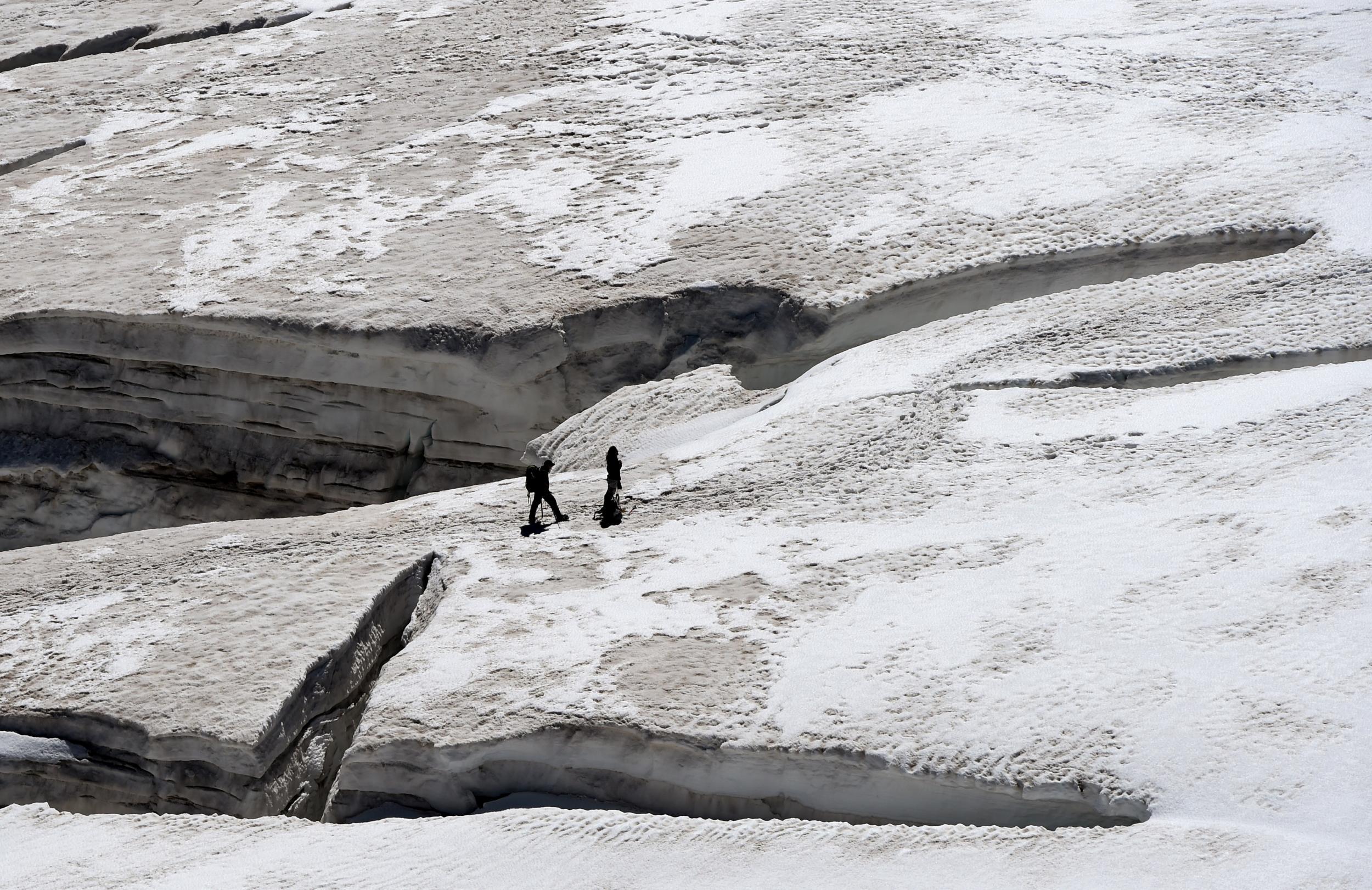 Climbers walk past crevasses in the Glacier des Géants in France (file pic)