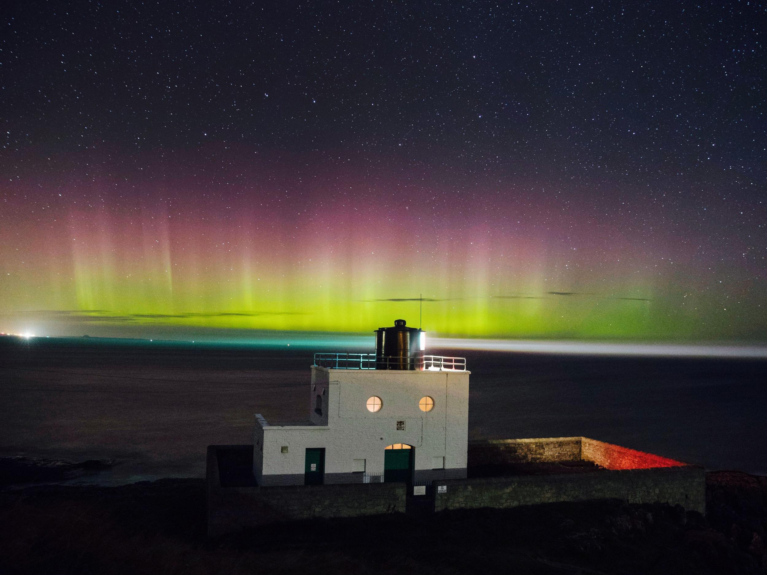 Northern Lights over Bamburgh lighthouse, Northumberland, in September