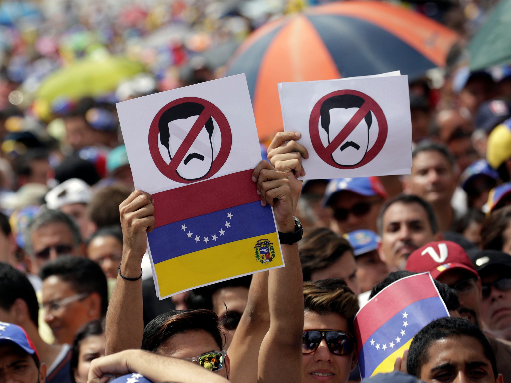 
Opposition supporters take part in a rally against Venezuela’s President Nicolas Maduro’s government in Caracas 