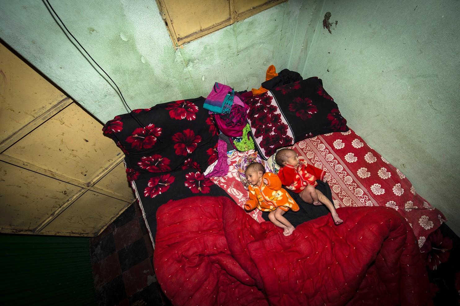 Twin babies of one of the workers in the Kandapara brothel