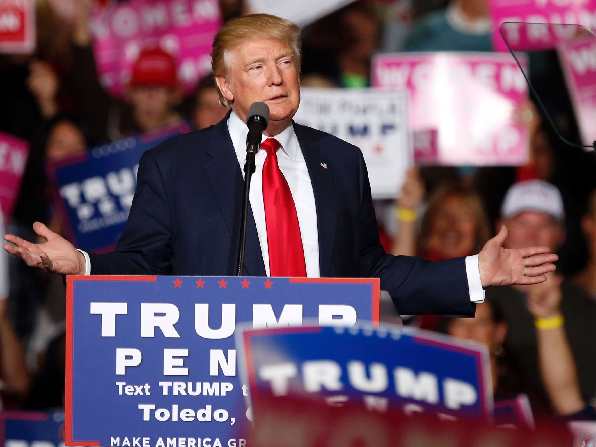 Republican presidential nominee Donald Trump speaks on stage at a campaign rally in Toledo, Ohio