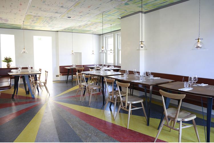 The modern upstairs dining area of The Marksman