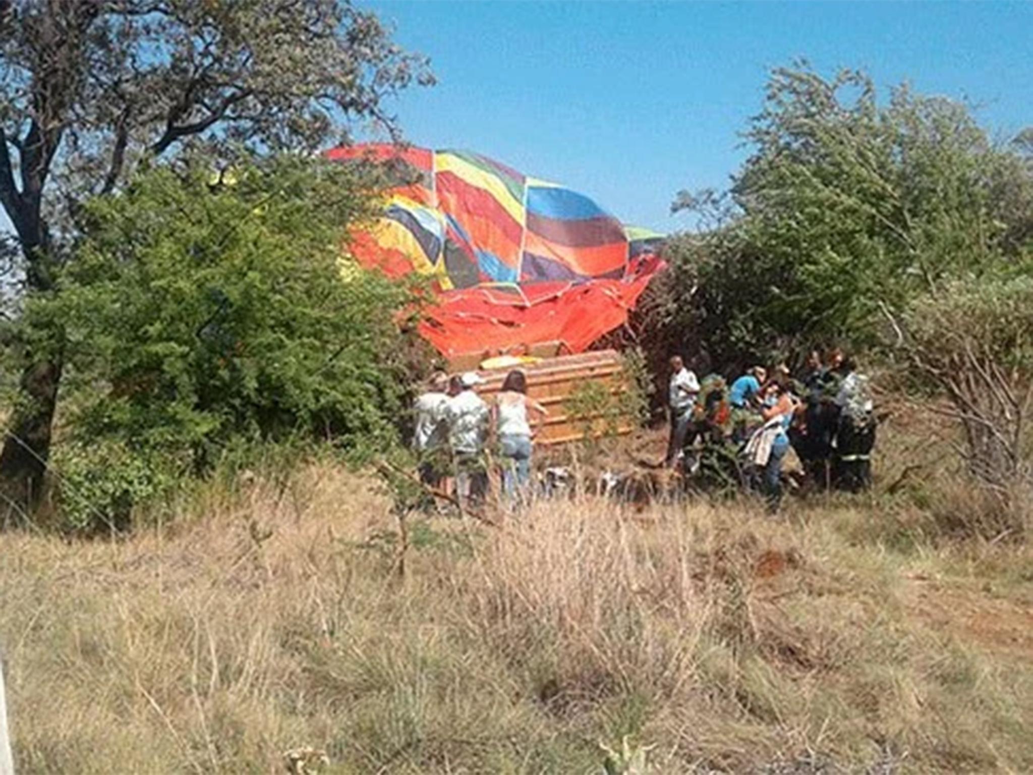 The balloon was reported to have crashed into rocks and a tree, seriously injuring three passengers