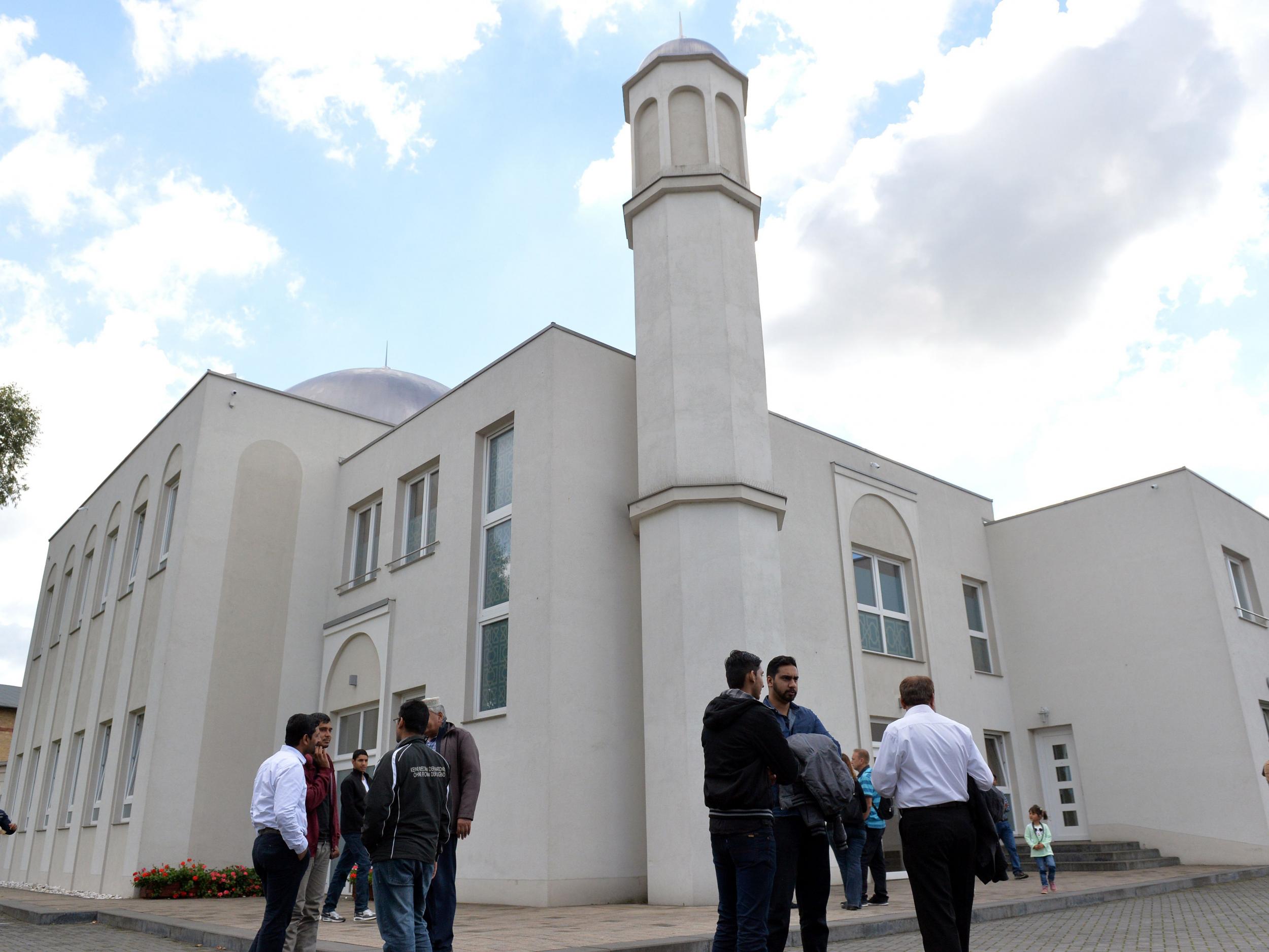 People stand in front of the Khadija mosque in Berlin