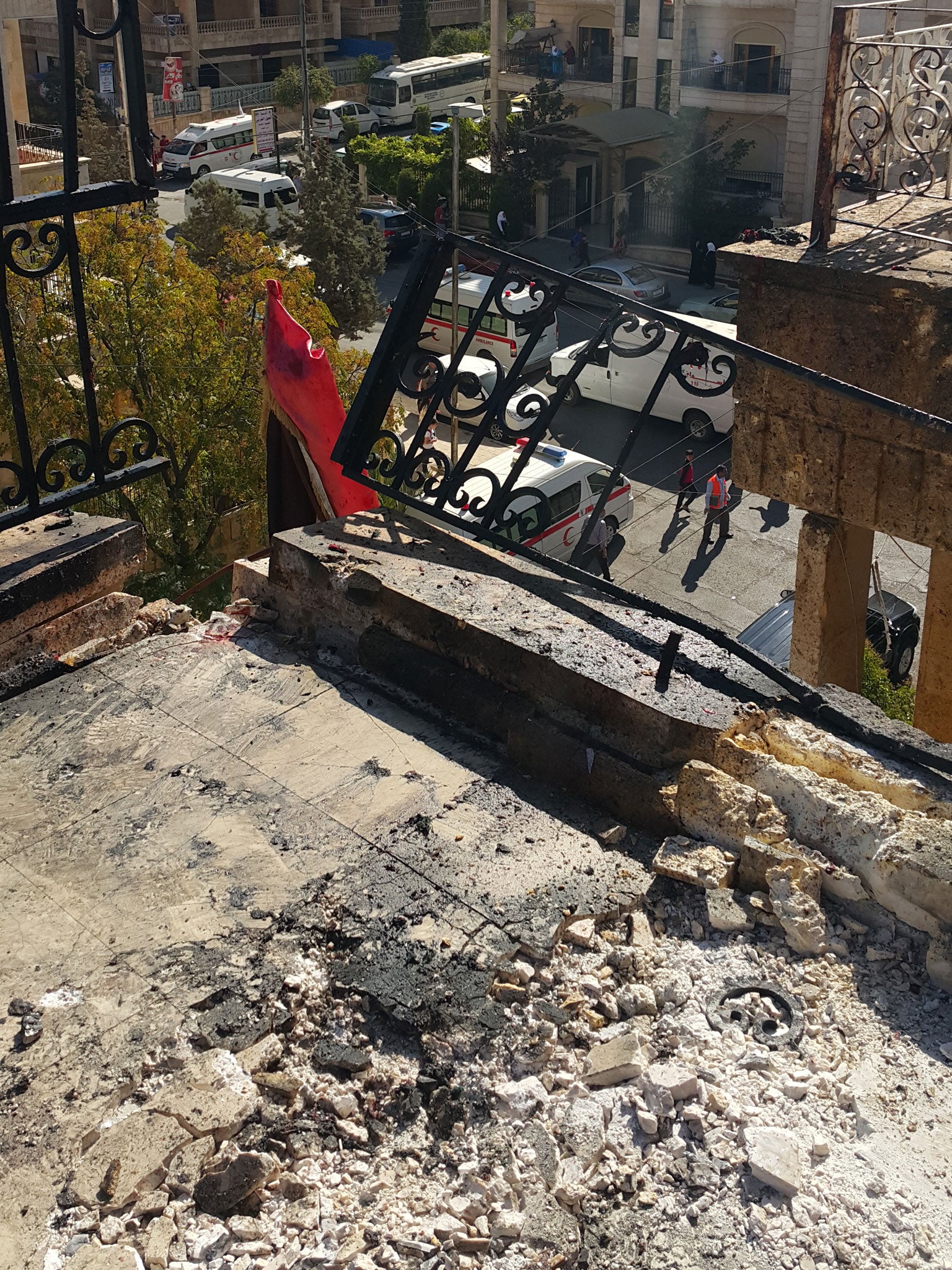 The torn balcony where a shell hit the school