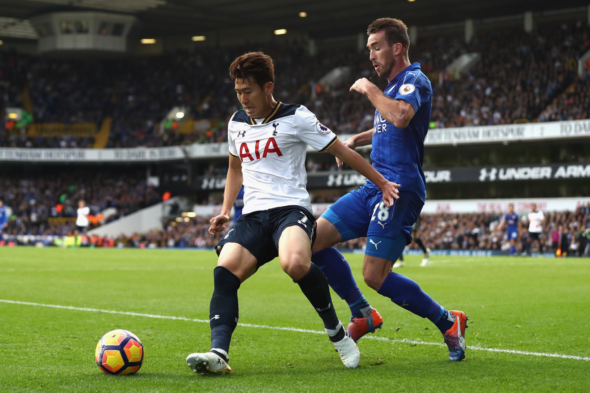 Son and Fuchs race for the ball