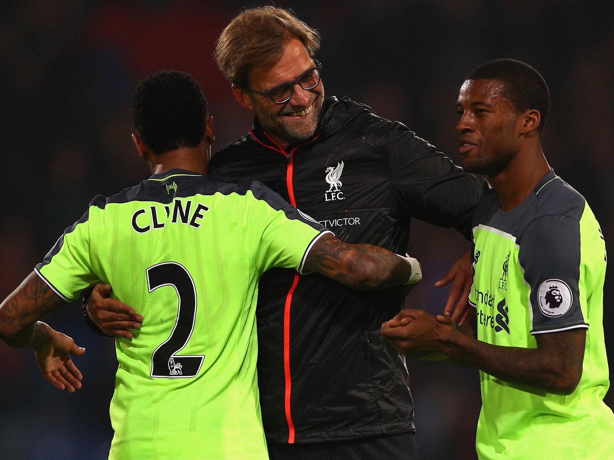 Jurgen Klopp celebrates the victory with Nathaniel Clyne and Joel Matip