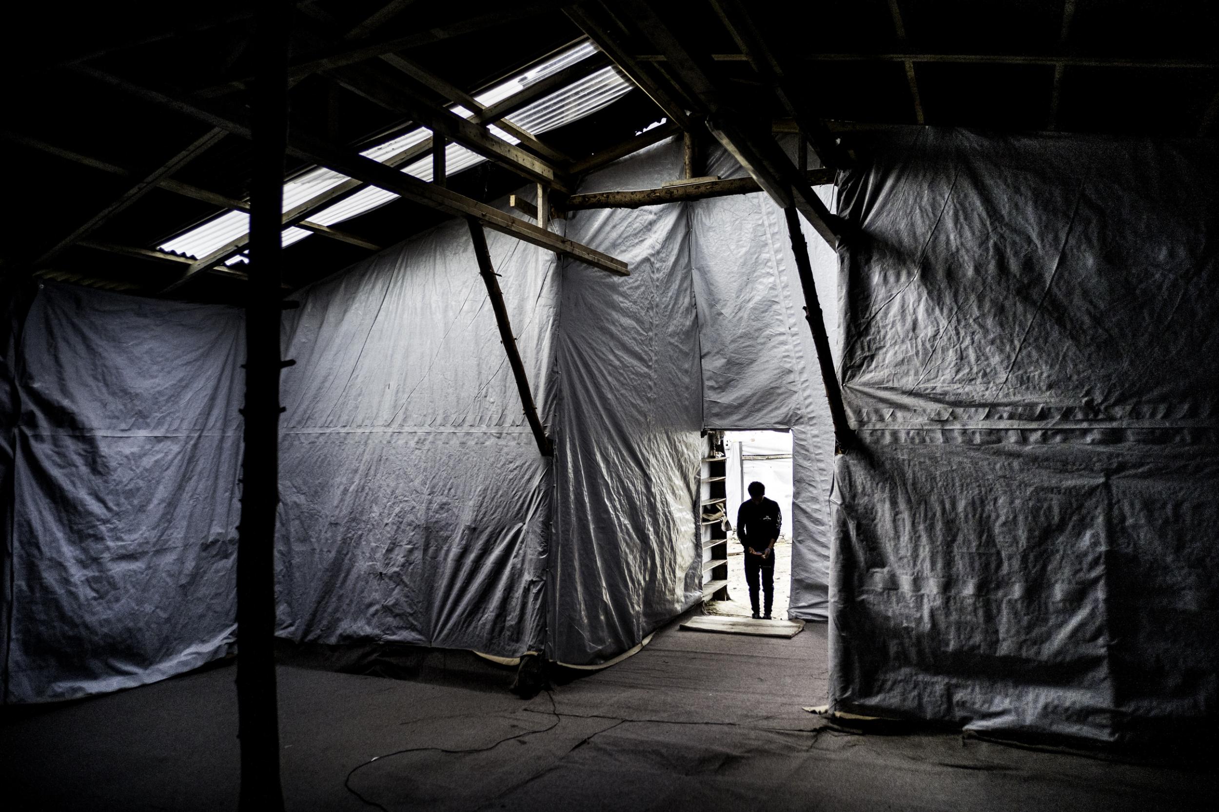 A minor visits the church in the camp for the last time before it is razed (Photo: Alan Schaller)