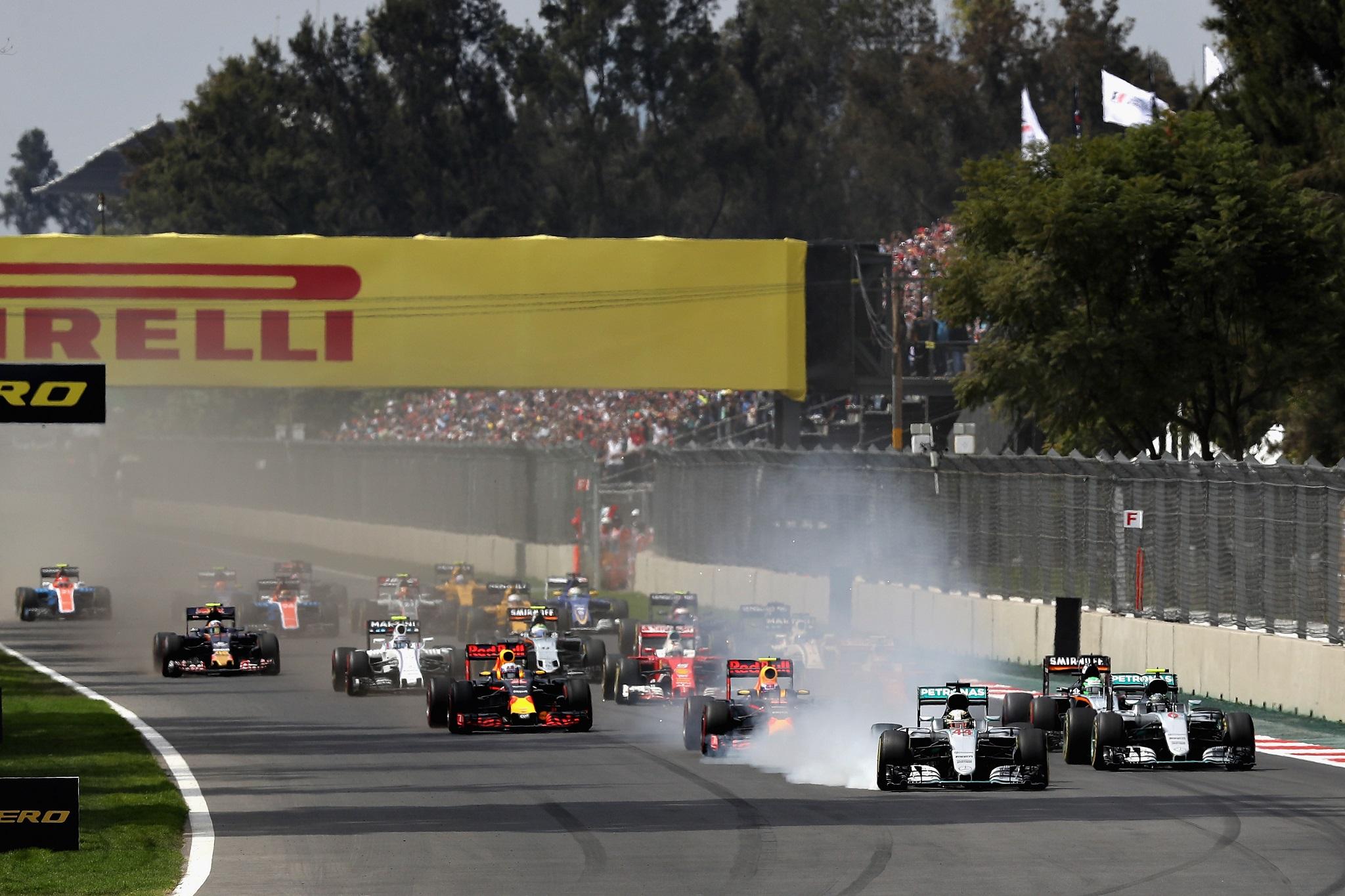 Lewis Hamilton locks up as he turns into the first corner