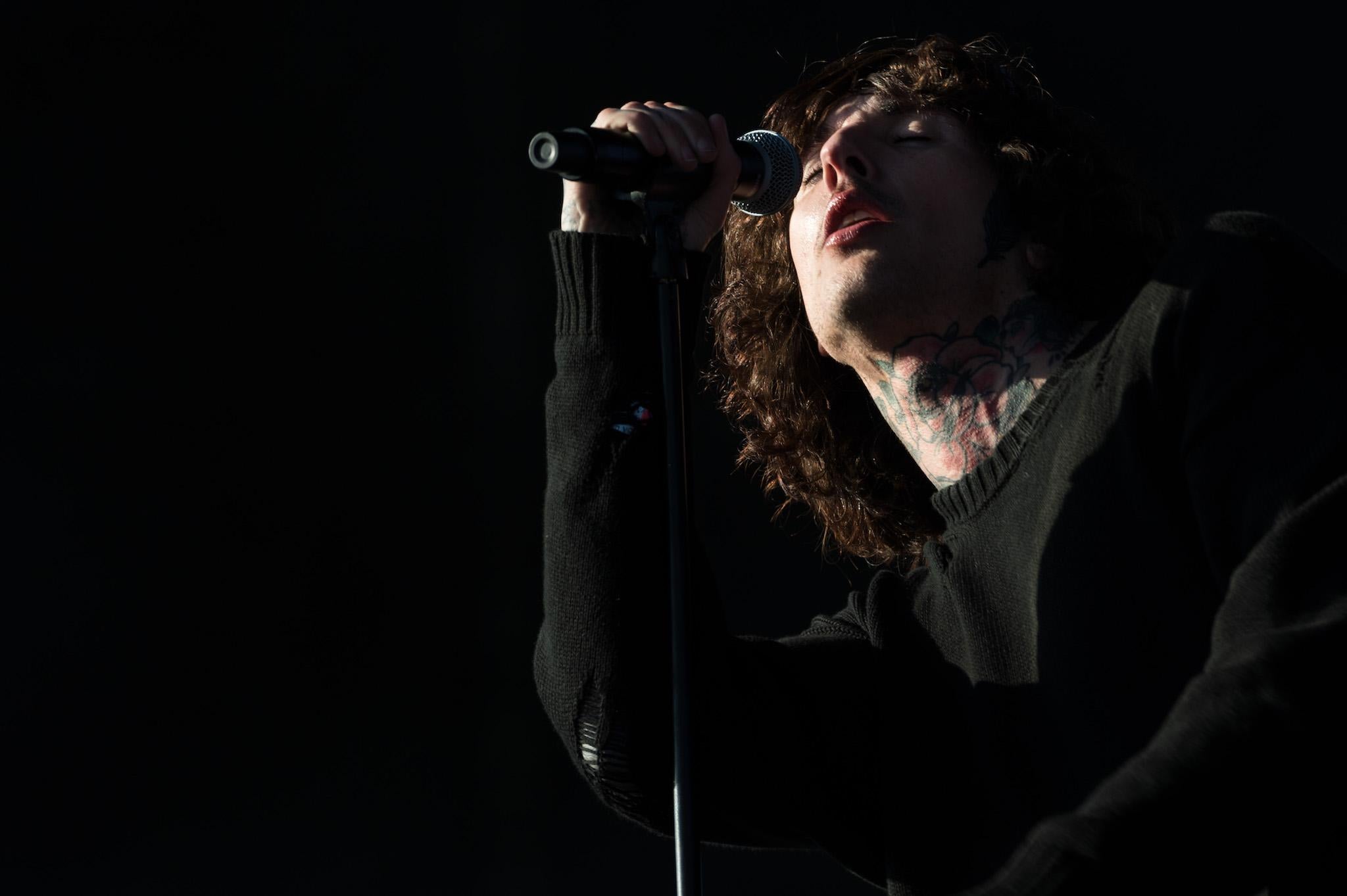 Oliver Sykes of 'Bring Me The Horizon' performs on the Other Stage during the Glastonbury Festival at Worthy Farm, Pilton on June 24, 2016 in Glastonbury, England