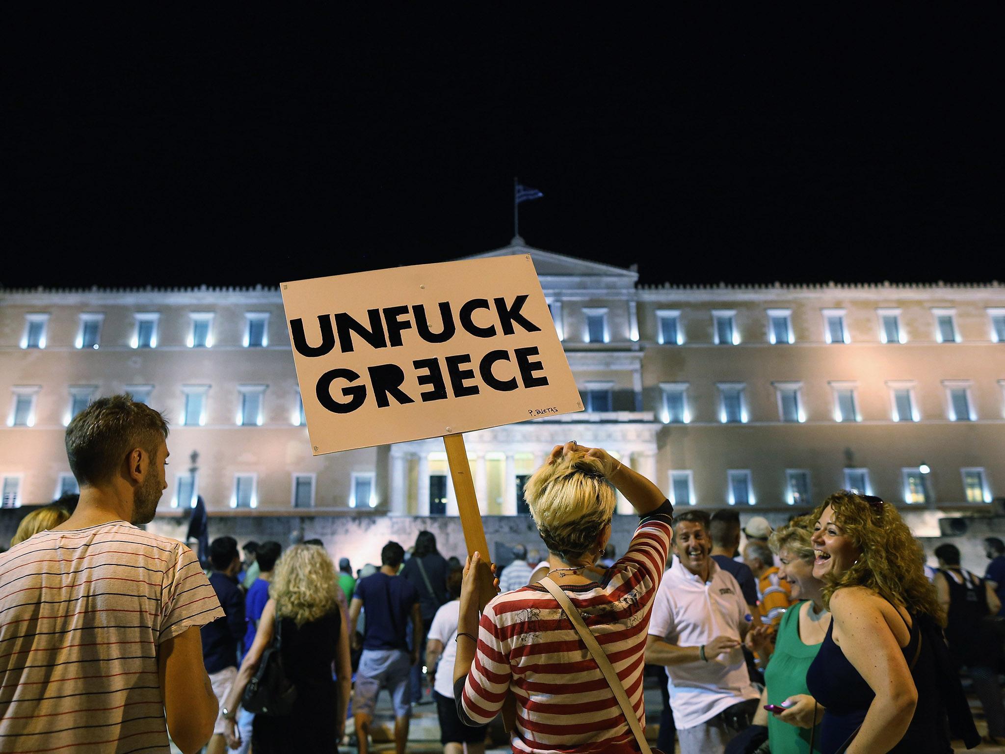 People gather outside the Greek parliament in Athens in July last year, on the night of the country’s bail-out referendum